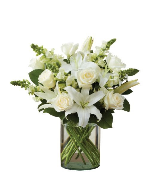 Classic All White Arrangement  Classic All White Arrangement  - All-around arrangement with white roses, lilies and snapdragons; accented with greenery Artistically designed in a classic glass cylinder vase