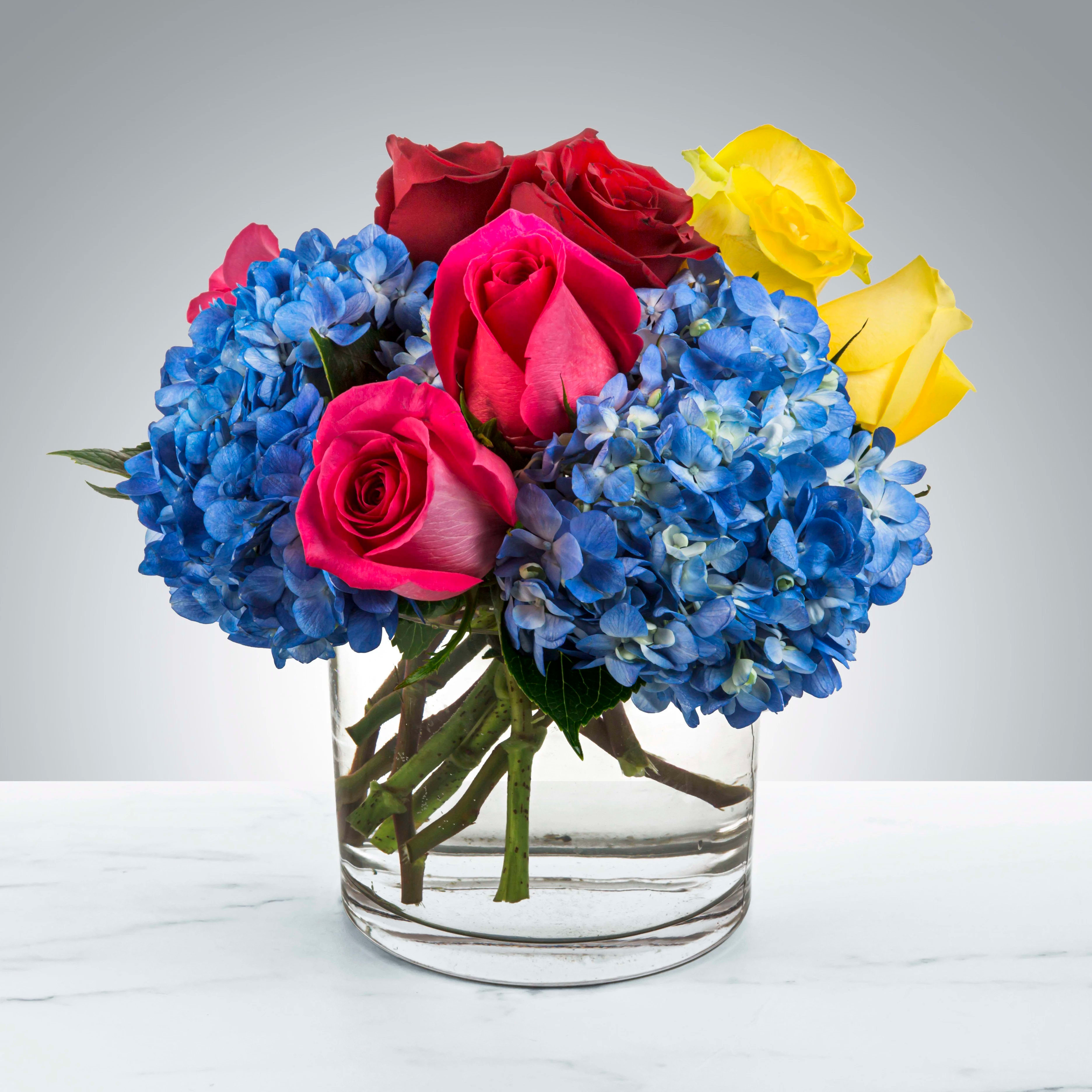 Eyes on You Eyes on You - A cute showstopper. Bright multicolored roses make this darling arrangement pop. Perfect for Best Friends Day, Parents Day, or just because, this arrangement will light up somebody's day. Please note: Flower varieties and colors may be substituted based on seasonal and daily availability. We always ensure your arrangement is of equal or greater value and just as beautiful.