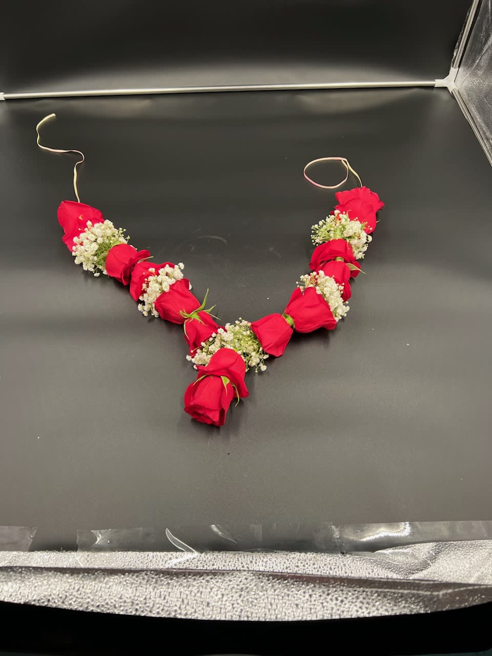 Roses And Babys Breath Mala Roses And Babys Breath Mala - This is an example of a rose and babys breath garland mala. Due to customization of flowers and colors it is best to call these orders in. Please note: Flower varieties and colors may be substituted based on seasonal and daily availability. We always ensure your arrangement is of equal or greater value and just as beautiful.