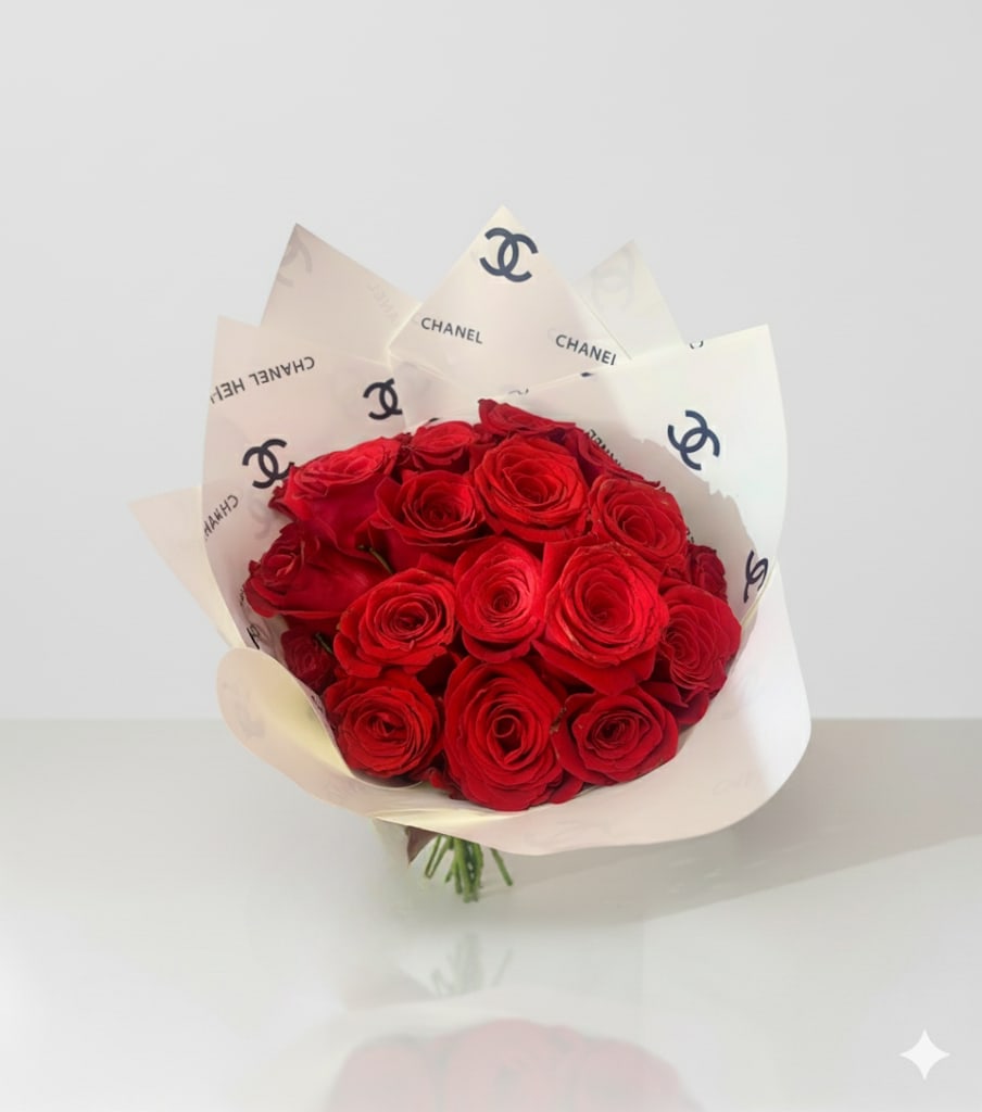 2 Dozen Red Rose Bouquet – Designer Inspired Floral Wrap 2 Dozen Red Rose Bouquet – Designer Inspired Floral Wrap - Make a bold and unforgettable statement with our Luxury Red Rose Bouquet, featuring premium red roses elegantly wrapped in designer-inspired paper. Perfect for anniversaries, birthdays, Valentine’s Day, or any special celebration, this sophisticated bouquet combines timeless romance with high-fashion elegance. Handcrafted by Je’La Diamond Luxe Gifts, this chic rose arrangement is more than flowers—it’s luxury you can hold.