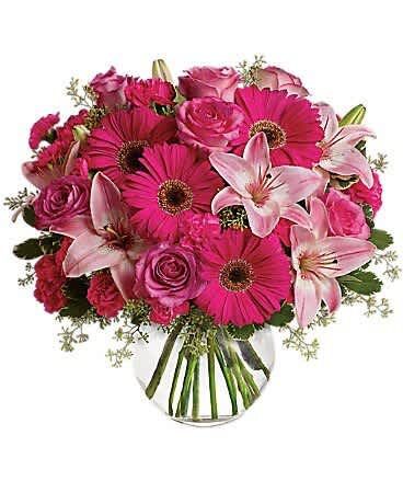 Vibrant Pink Bloom Bouquet - A lively mix of pink gerbera daisies, lilies, roses, and carnations in a classic glass vase. Perfect for celebrations, love, or just because. Same-day flower delivery in The Colony, Frisco, Little Elm &amp; all DFW.”
