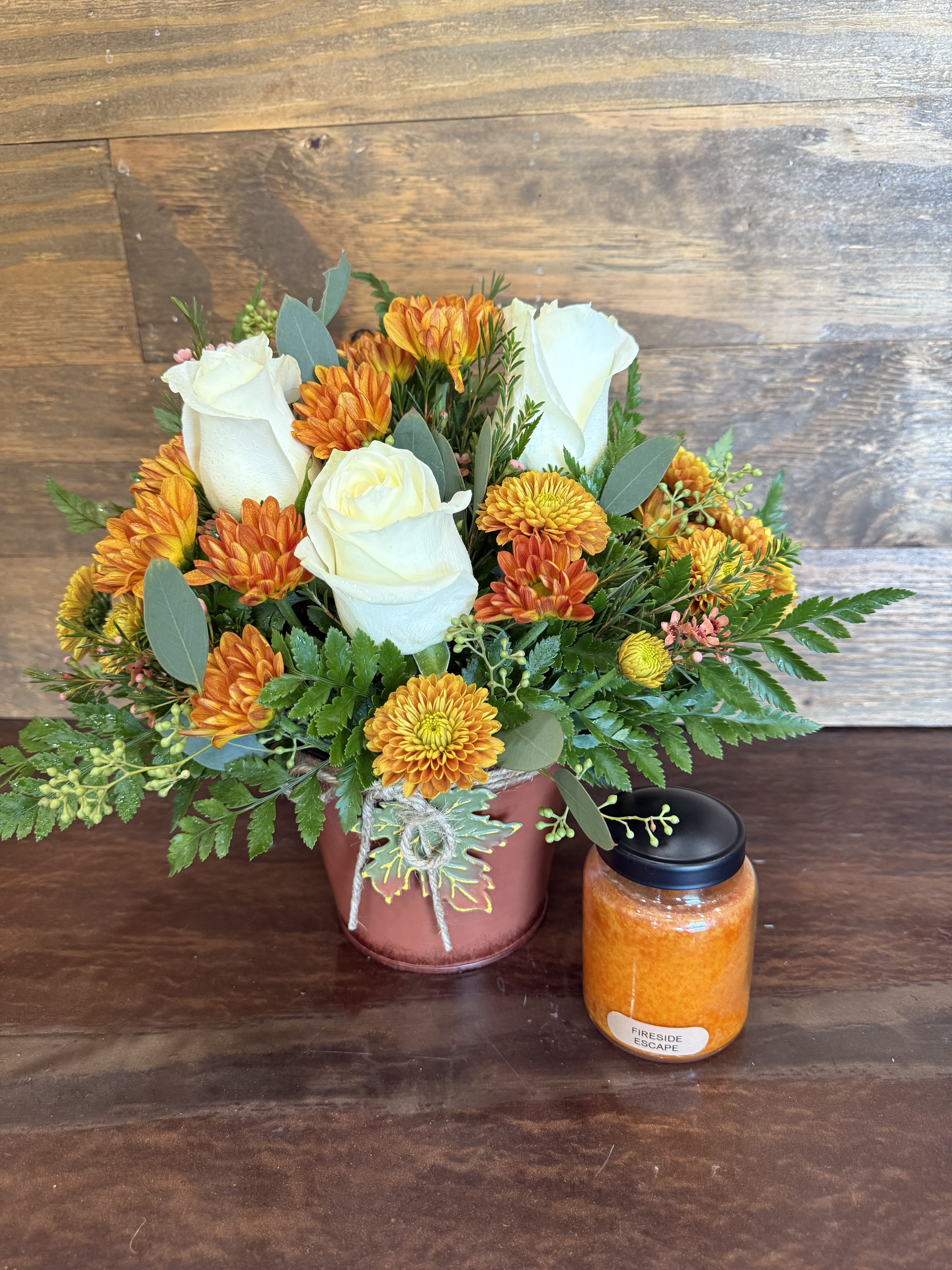 Autumn Delight  - Send an adorable Autumn bundle with this beautiful floral arrangement and a mini candle! 