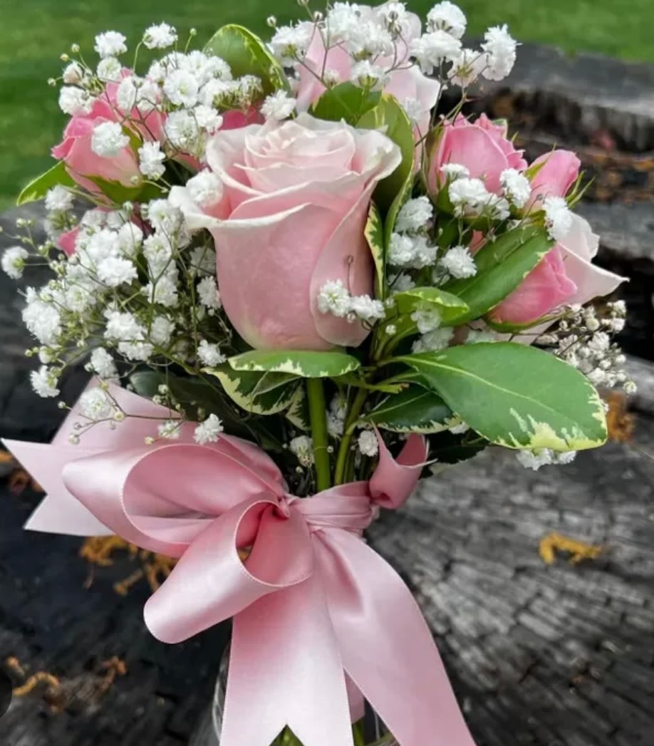 All pink mini dance bouquet All pink mini dance bouquet - This bouquet features pastel pink roses and pink spray roses accenteds with babys breath.