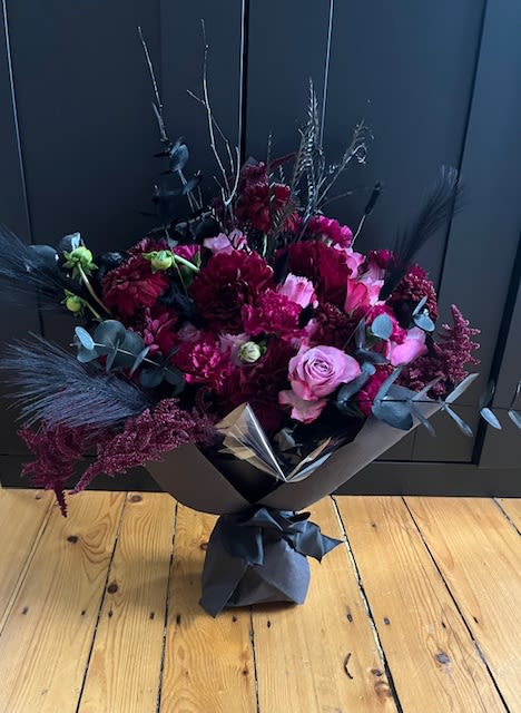 The Morticia Bouquet - The perfect gift for someone who finds beauty in the bold!  A hand-tied wrapped bouquet of dahlia, mum, roses, black eucalyptus, pampas and mixed autumn accents.   Not only is this bouquet a stunner but she is also a mood! 
