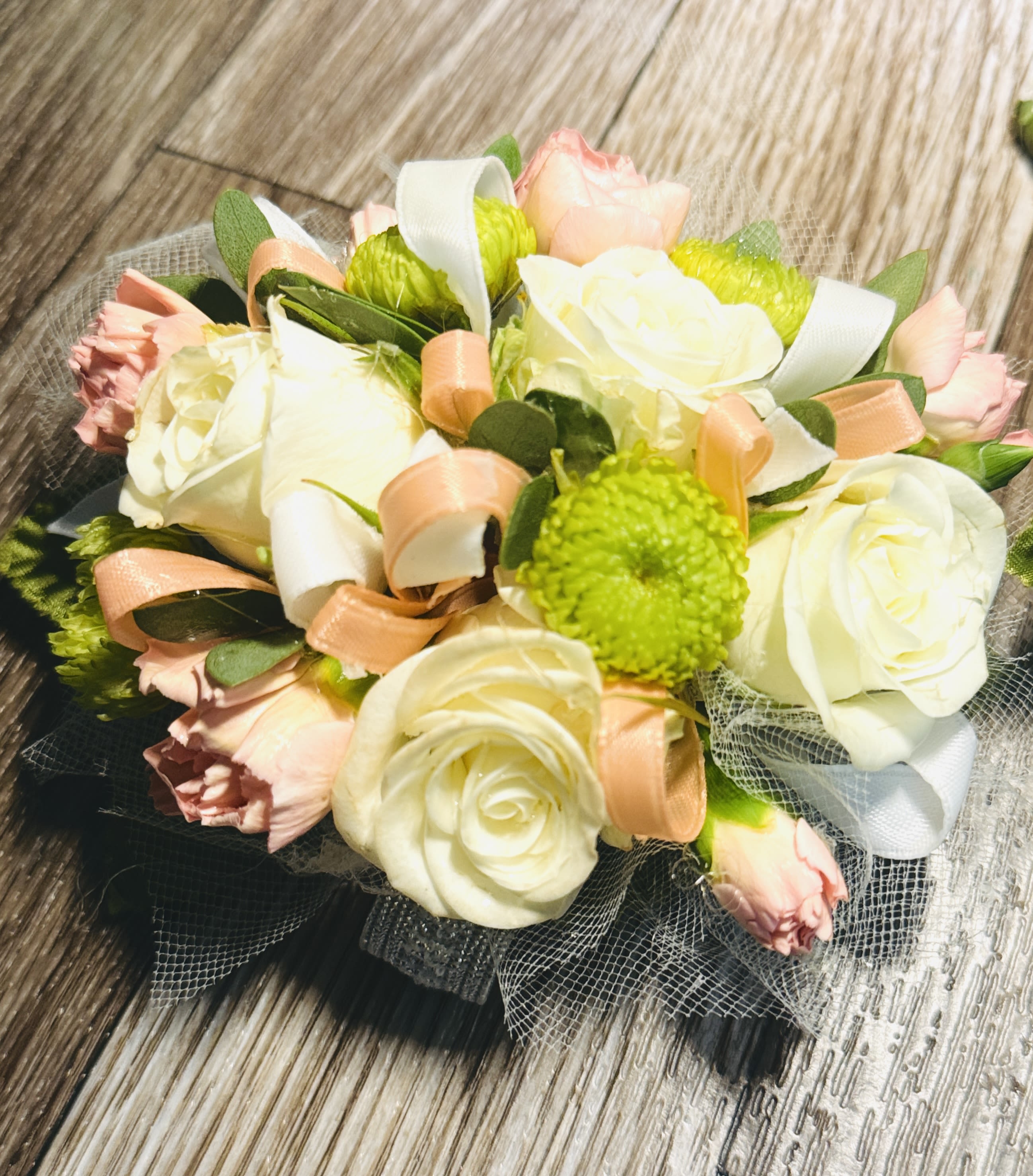 Perfect Pairing  - The combination of roses and carnations creates a beautiful contrast between the delicate, velvety rose petals and the frilly, textured carnation blooms. It gives a balanced, full, and timeless appearance—perfect for formalwear and special events