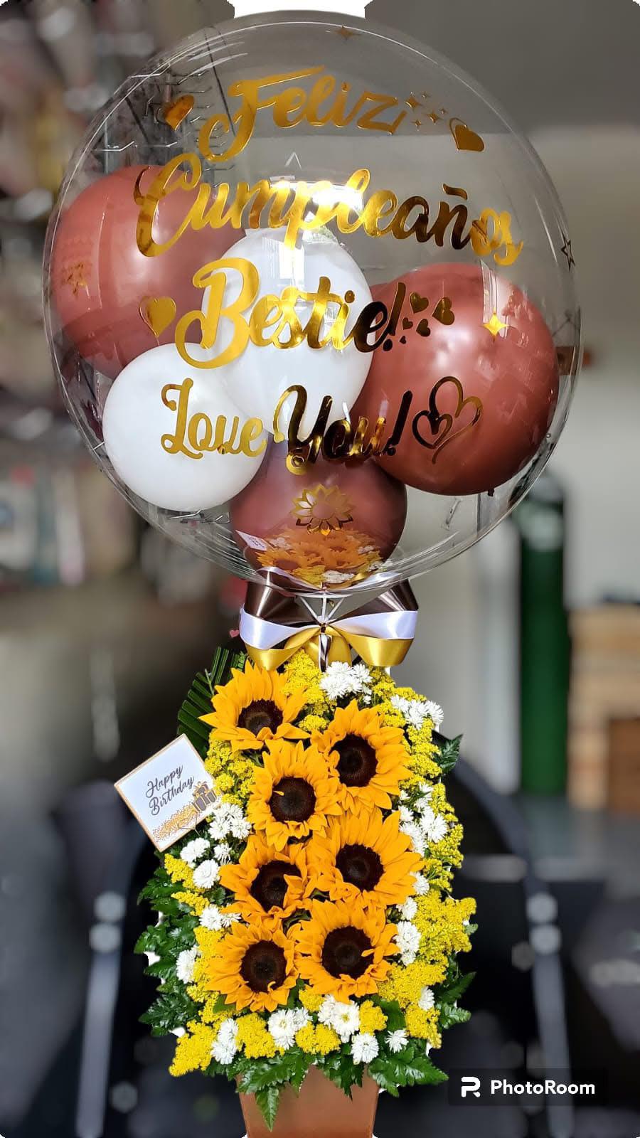 detalle simple  - este es un detalle elaborado con jirasoles y un globo transparente que por adentro tiene rosa plateado