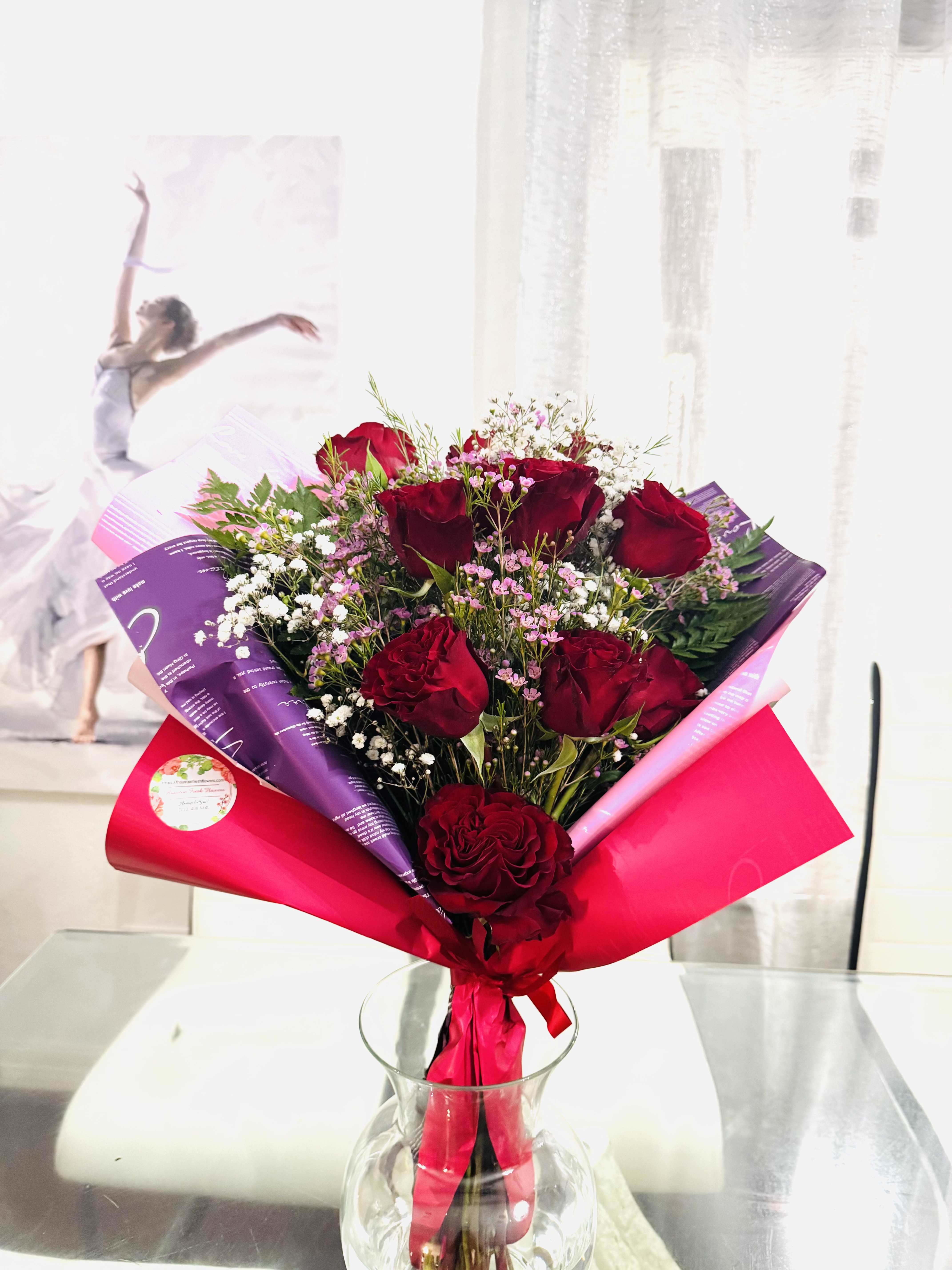 Thinking of you- wrapped - This bouquet is timeless expression of deep love and poetic elegance. A passionate composition of red roses intertwined with the pure charm of lilies and delicate baby's breath, all embraced in beautiful wrapped waterproof paper. The red roses speaks of eternal love and heartfelt desire, while the lilies add a whisper of innocence and new beginnings. This bouquet declares grace, strength, and poetry. 