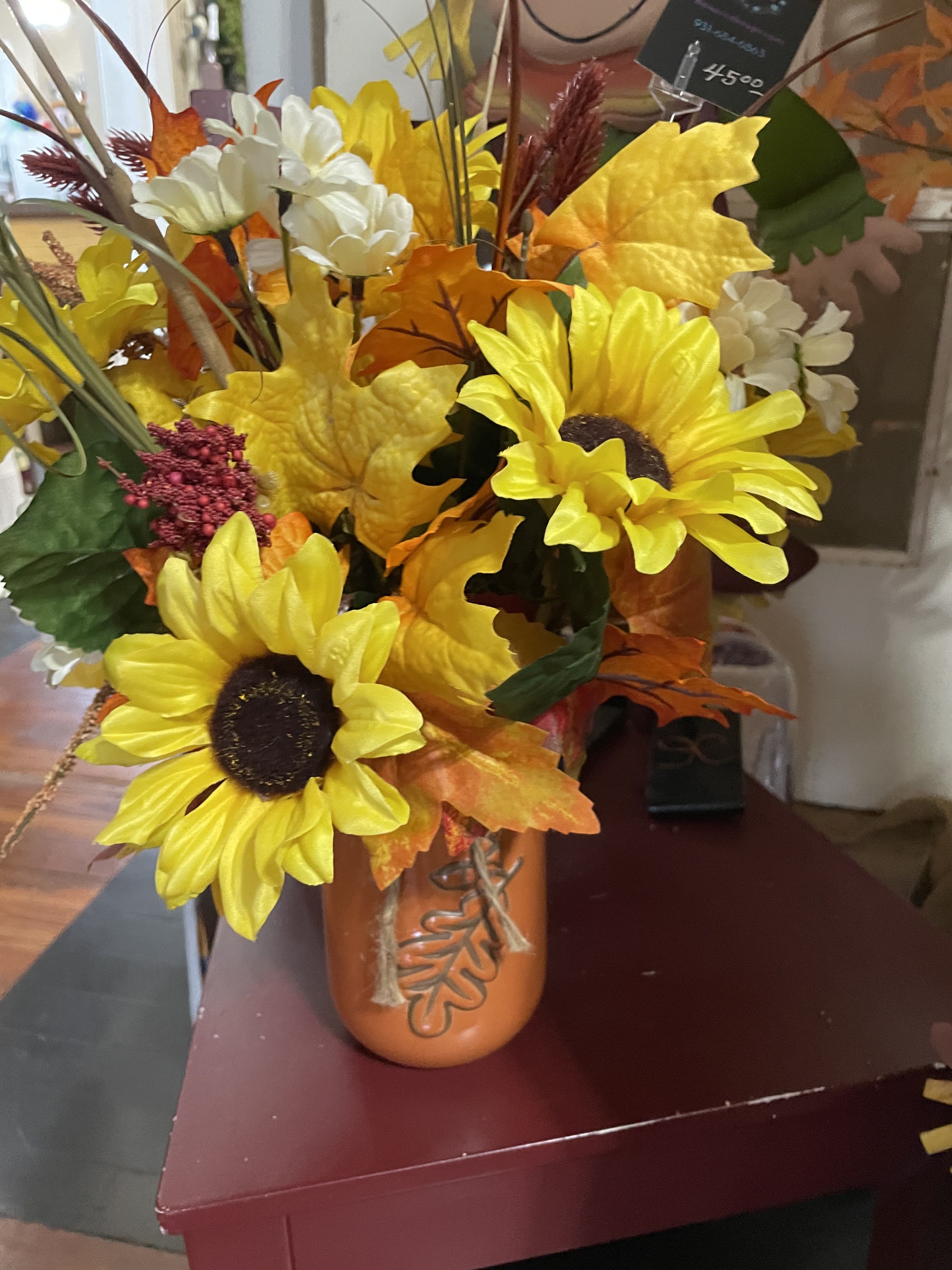 Maple Leaf Silk Jar  - A lovely silk arrangement for the home in soft and beautiful shades of fall tones. Designed in an orange mason jar. 