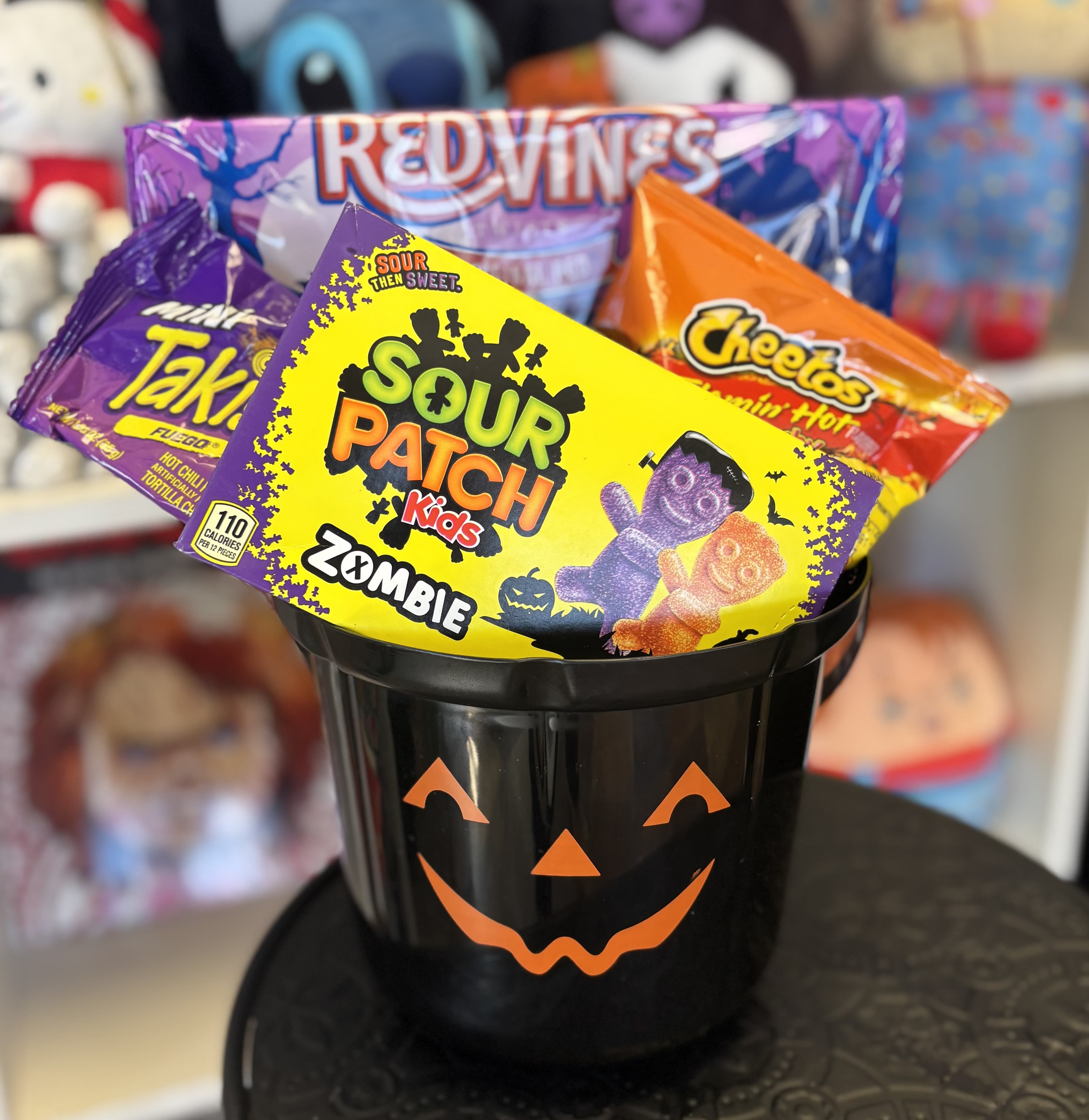 Trick or Treat  Snack Basket  - Hot Cheetos , takis , red vines and sour patch in pumpkin basket 