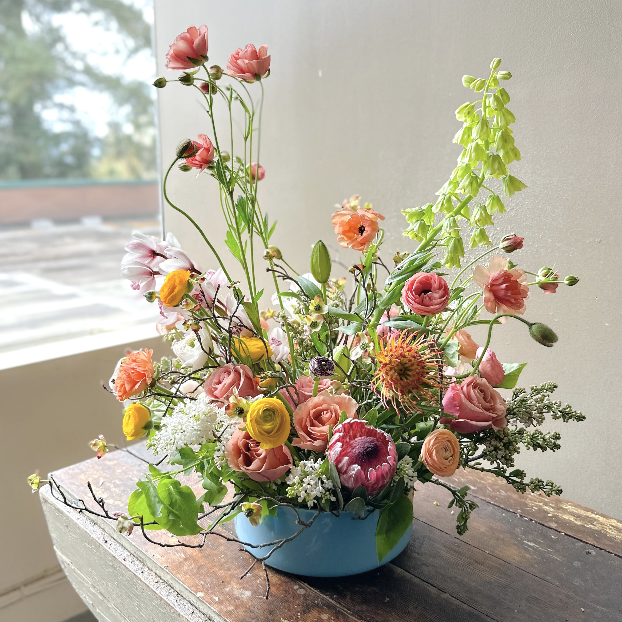Amalfi (Gallery Photo) - Send these vibrant, juicy blooms arranged in a low turquoise ceramic vase — perfect for someone who treasures creativity and delights in a unique botanical beauty!