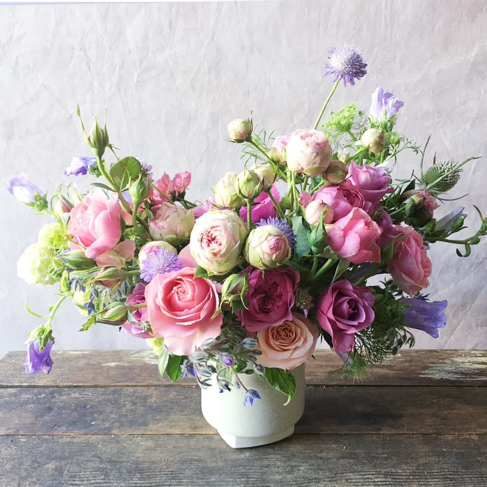 Rhys (Gallery Photo) - Send these gorgeous blooms to bring romance and beauty of the season to your loved one's day! Various  garden roses that are locally grown and other seasonal flowers are artfully gathered in this ceramic vase.  