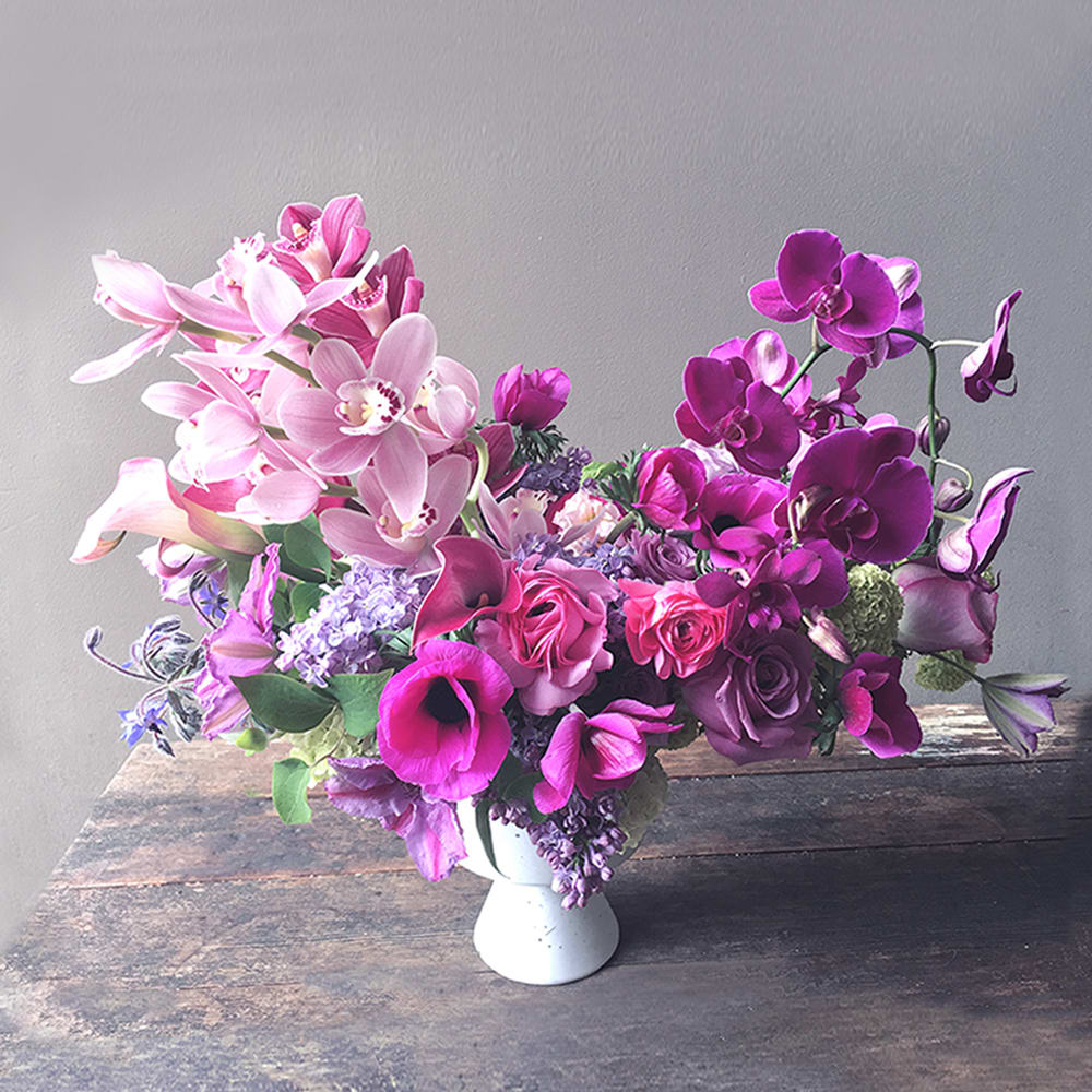 Areum (Gallery Photo) - Beautiful pink orchids are gathered in this floral design that feels modern and artful! With so many botanical details to enjoy!