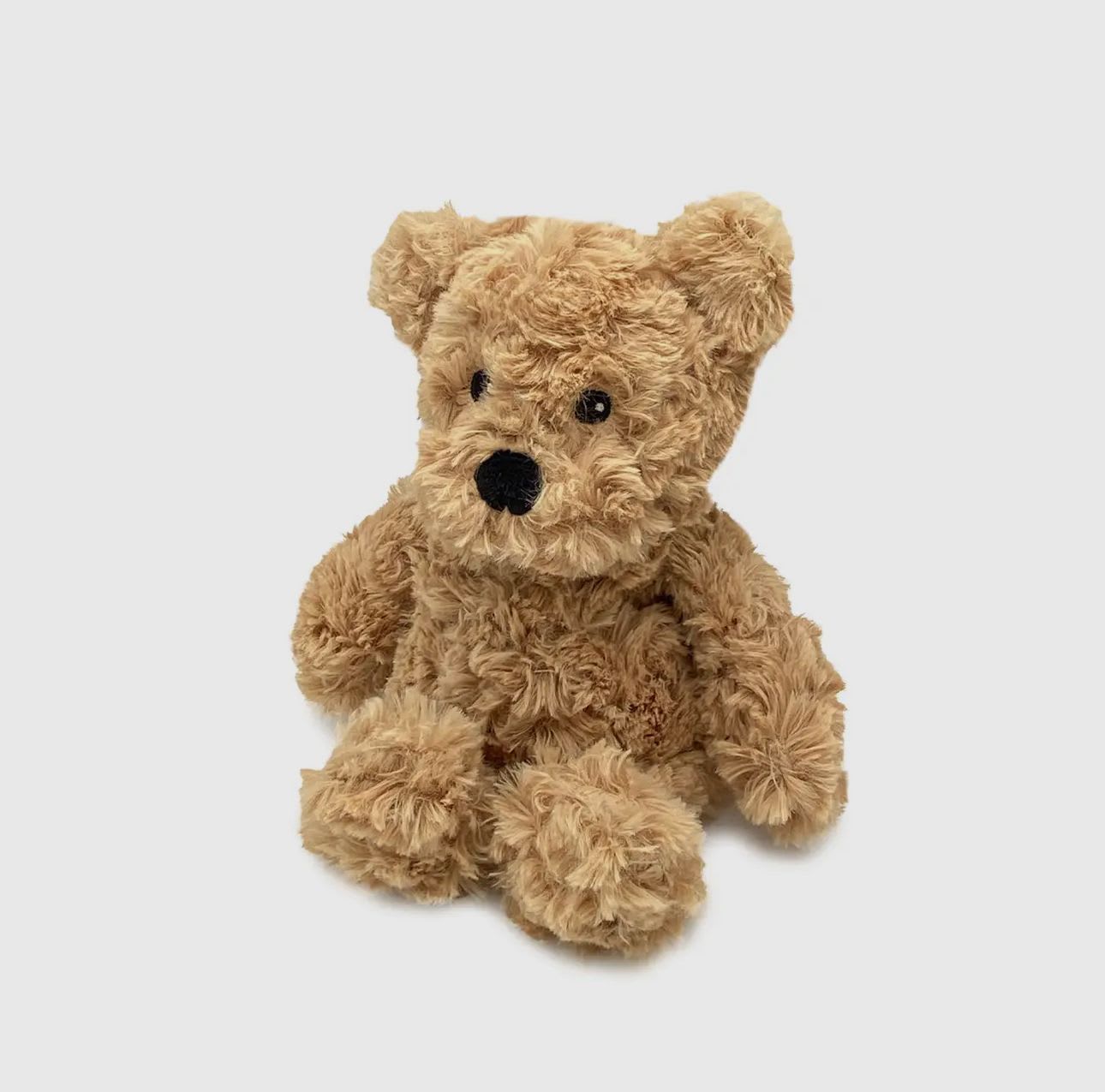 Brown Curly Bear Junior  - Warmies® Brown Curly Bear Junior – Small Microwavable Plush with Lavender  The Warmies Brown Curly Bear Junior may be smaller in size, but it’s big on comfort! This travel-sized plush is filled with natural flaxseed and real French lavender, offering gentle warmth and soothing aromatherapy when heated in the microwave.  Perfect for little hands, on-the-go snuggles, or comforting car rides, this mini bear is a thoughtful gift for kids or anyone needing a pocket-sized dose of calm. Pair it with a small flower arrangement from The Blooming Bud for a sweet and cozy surprise.