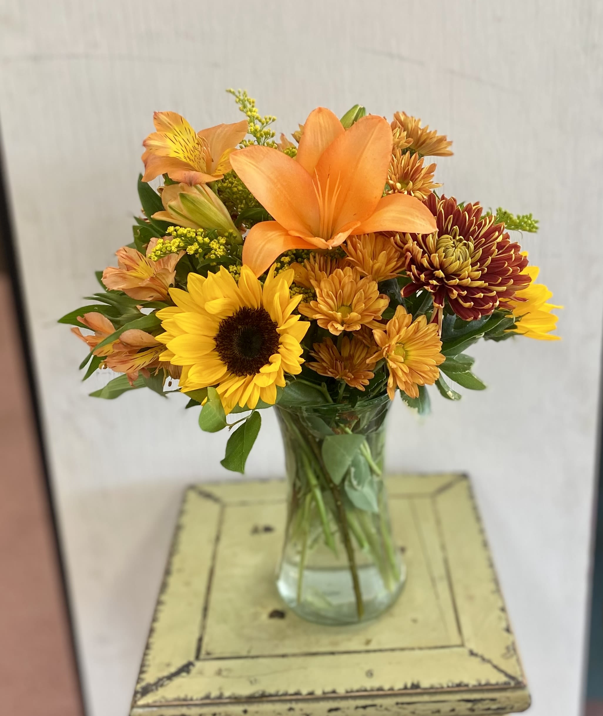 Fall Vase Fall Vase - Bright autumnal tones. A beautiful selection of long lasting blooms.