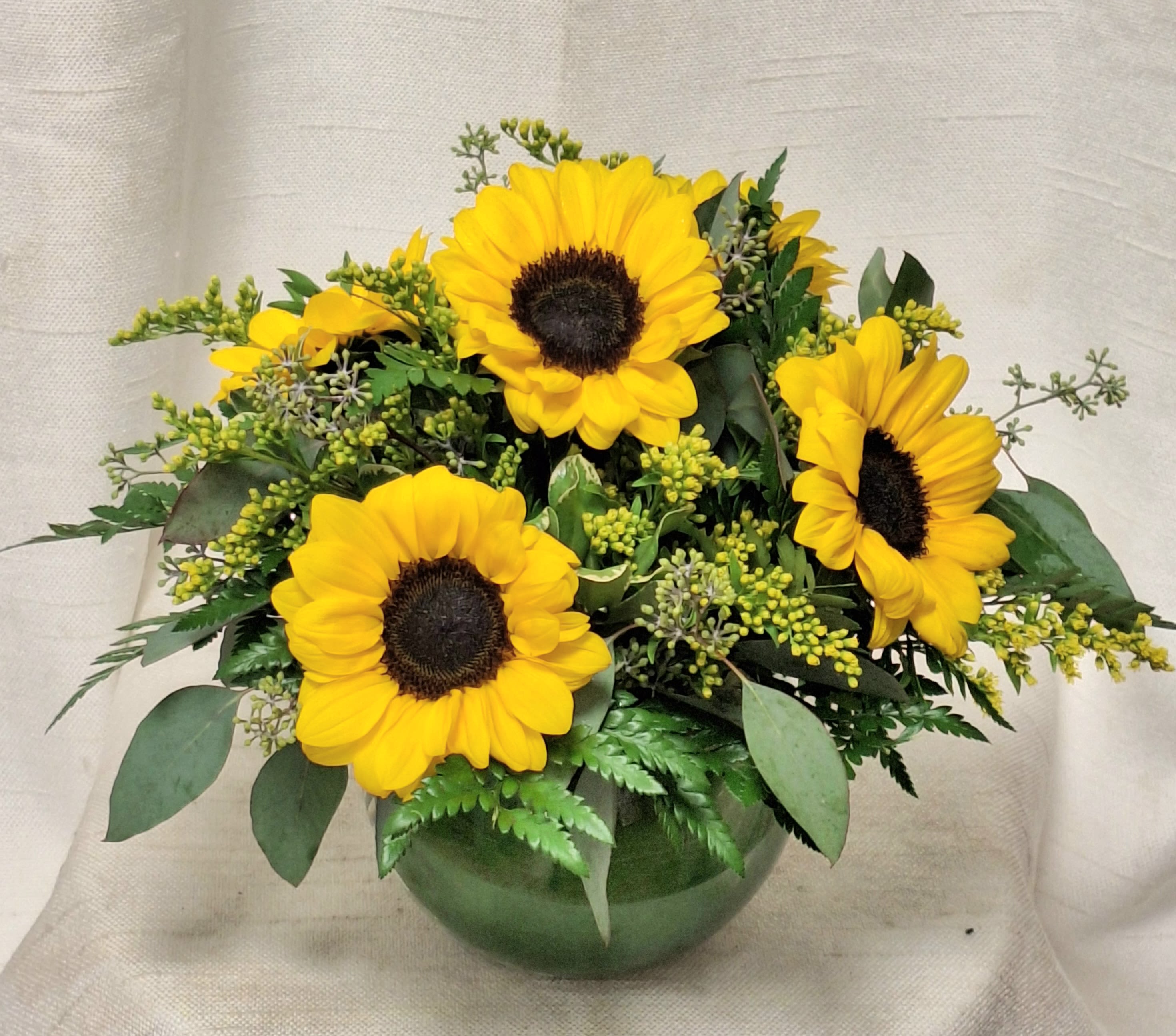 Summer Sunflowers (BR) - Introducing &quot;Summer Sunflowers,&quot; an arrangement that radiates warmth, joy, and the beauty of nature. This delightful bouquet is filled with vibrant sunflowers, lush greens, and filler, capturing the essence of a sunny summer day.  