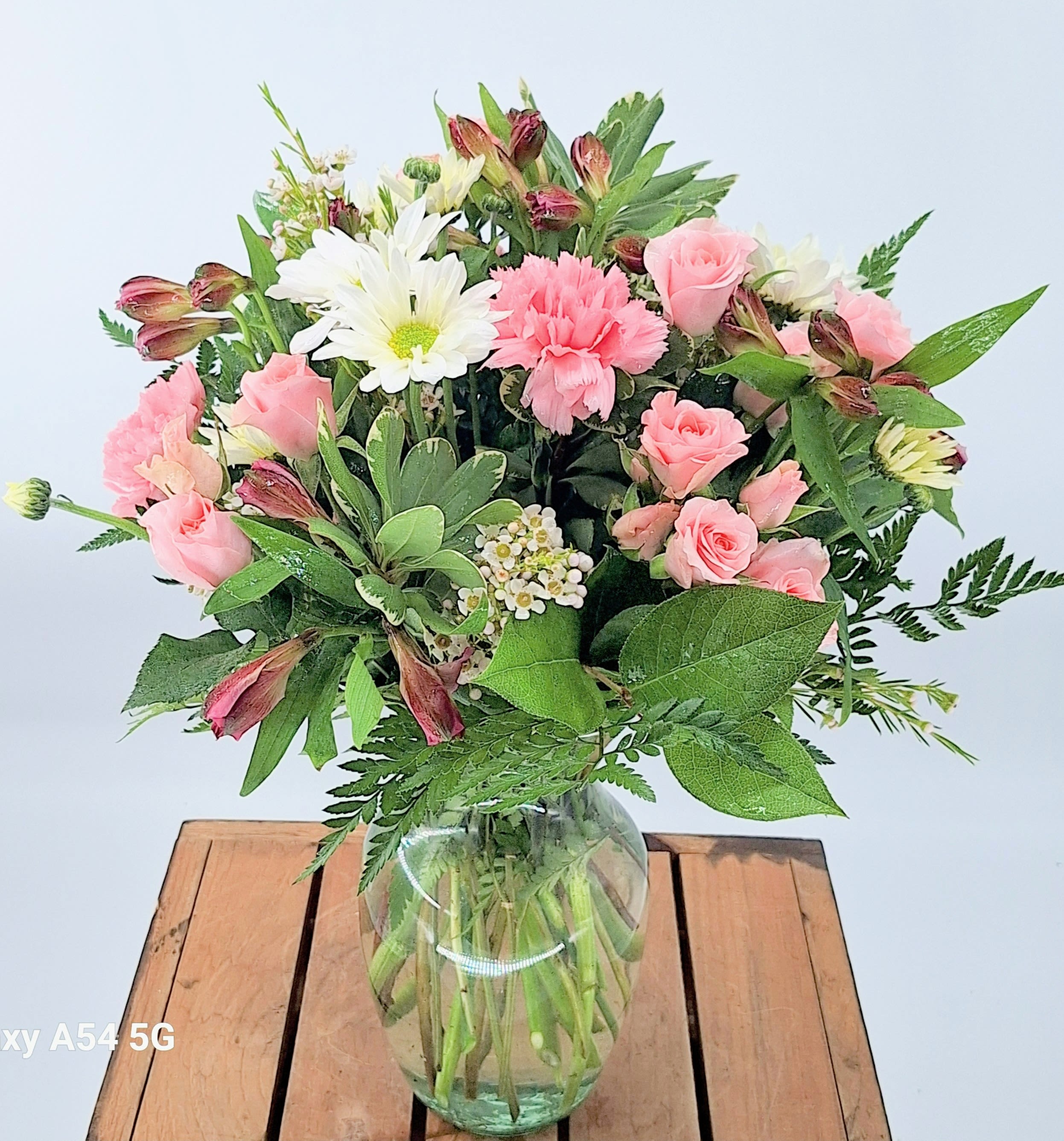 Delicate Crush (BR) - Whoever you're sending this bouquet to, your loved ones are sure to crush hard on these gorgeous pink and white shades.  Mini spray roses, carnations, daisies, alstroemeria, and premium greens.