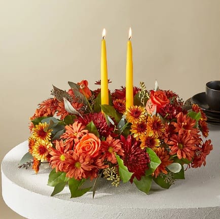 Banquet Centerpiece - Cast your holiday meals in a whole new light with this lovely centerpiece, which draws from the season's most stunning bronze, red and orange florals and foliage.