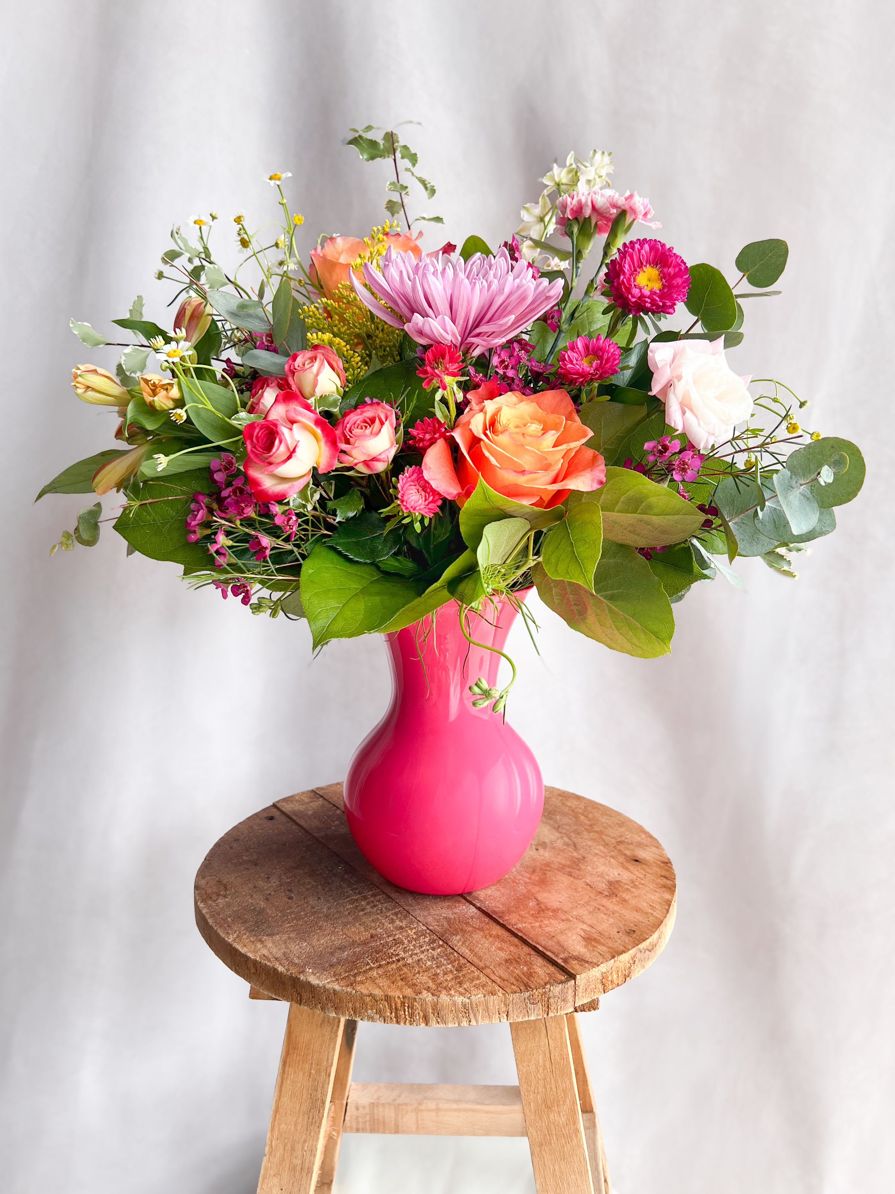 Bright &amp; Blooming - Bursting with joyful color and whimsical textures, Bright Meadow is a designer's choice arrangement that captures the untamed beauty of a wildflower field. Featuring seasonal blooms in vibrant cheerful tones, each design is one-of-a-kind - perfect for brightening someone's day or celebrating life's joyful moments. While specific flowers may vary with the season, the lively spirit and radiant palette will always shine through. 