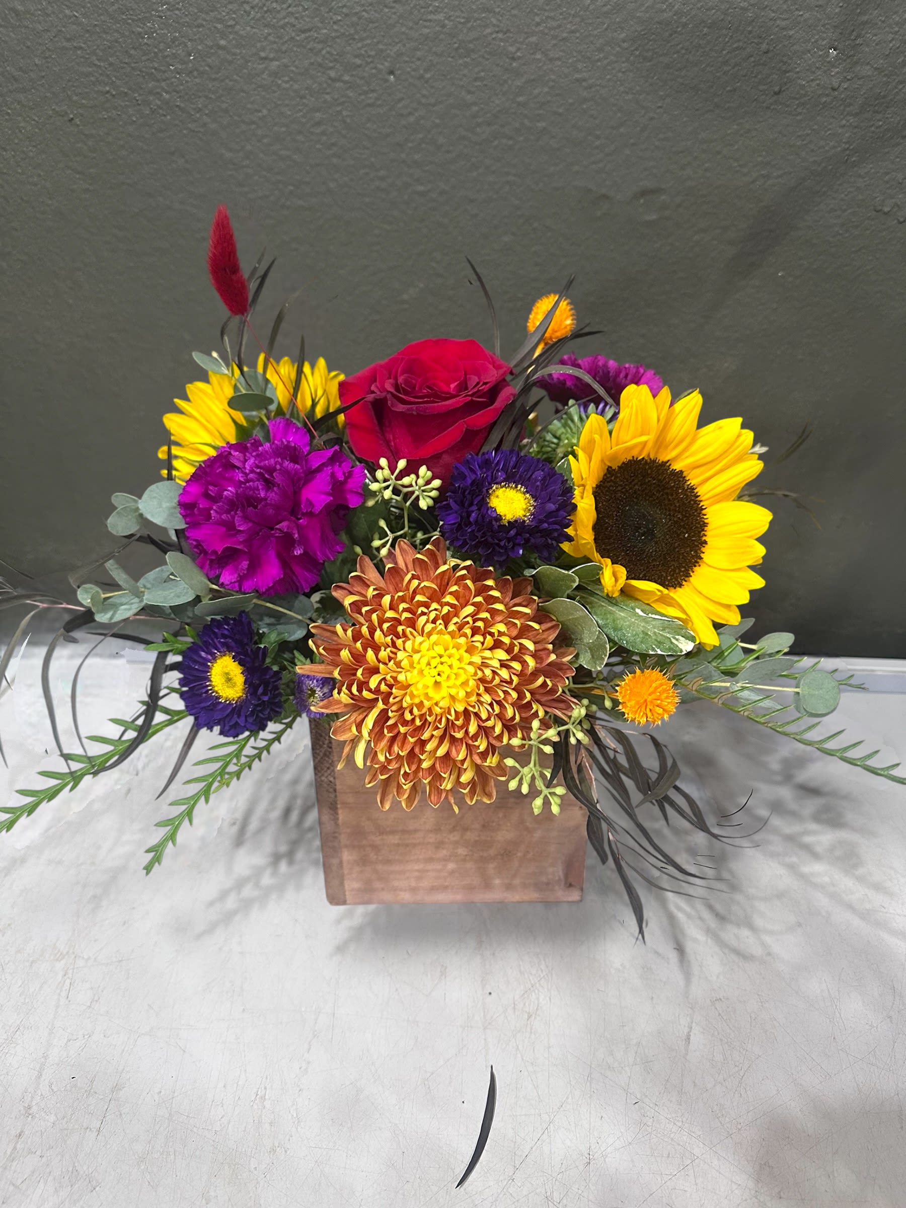 Fall Season Box Fall Season Box - This arrangement likes two things: being inside of a box and delivering happiness in the form of fall flowers. And it’s already inside of a box. Do this arrangement a favor and let it deliver happiness to someone. Order one today!