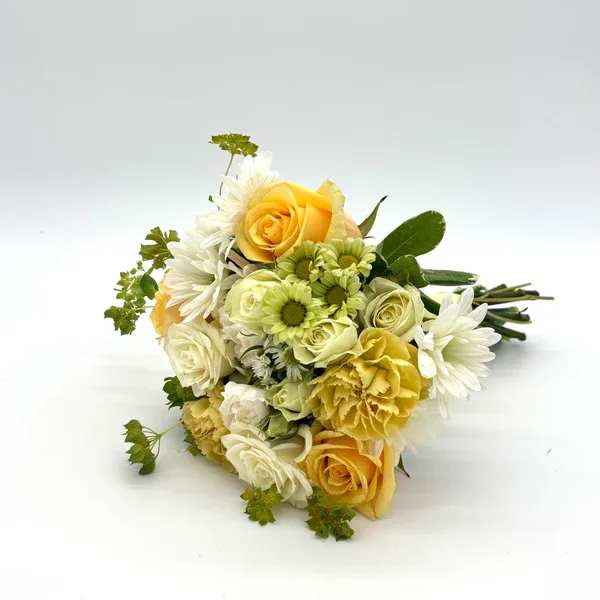 Lemon Drop Nosegay - Bright look with a variety of fresh yellow, white and green florals. When ordering please specify your choice of satin ribbon color under special instructions or it will be wrapped in a neutral color. Designers may need to implement substitutions, however will follow the general arrangement style and color theme. Standard price point is pictured.