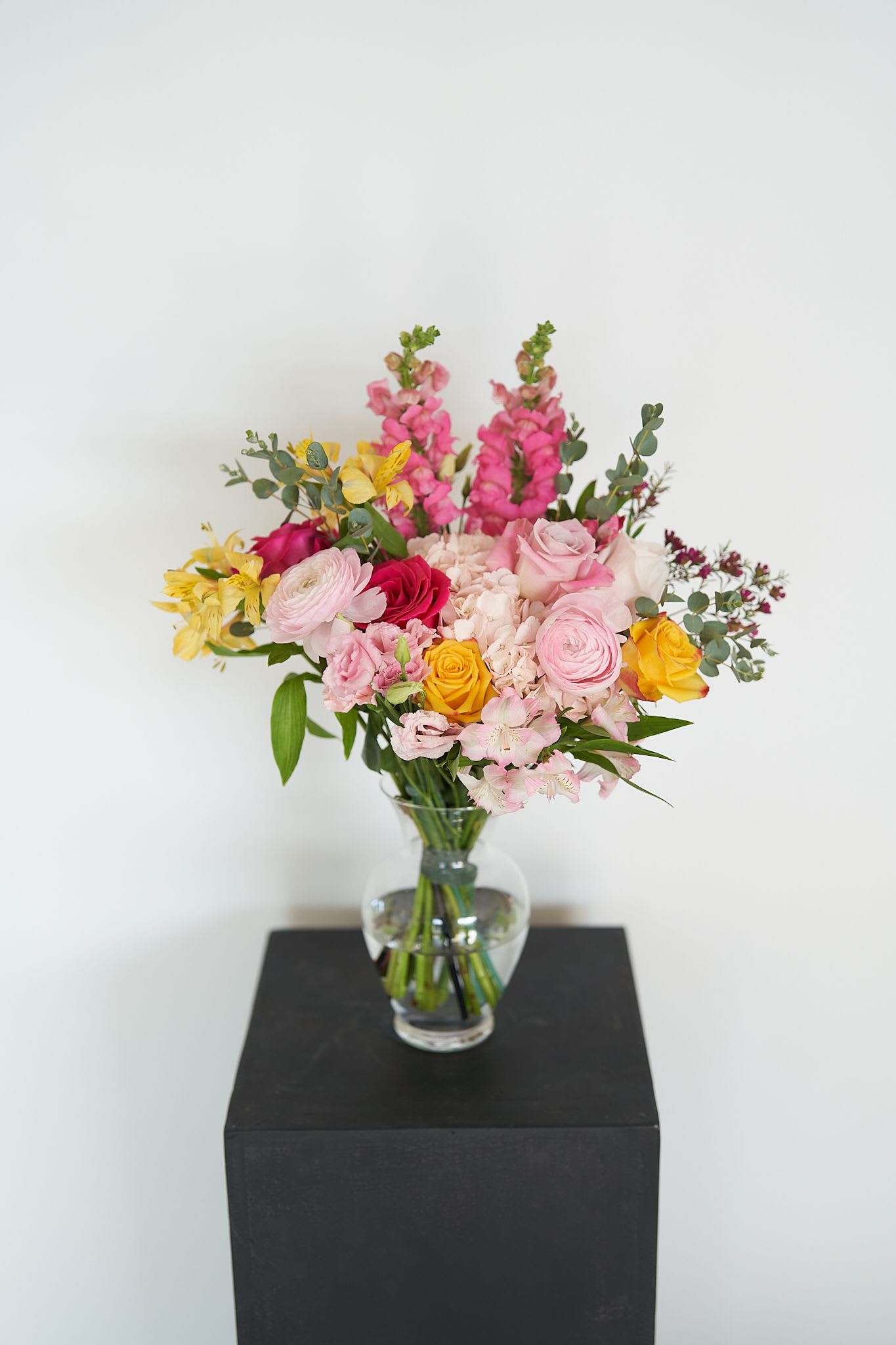 Colorful Arrangement - The selection of blooms varies seasonally The photo shows only a sample of the color palette and style. The final arrangement will be similar to the photo but will have unique and distinctive characteristics.