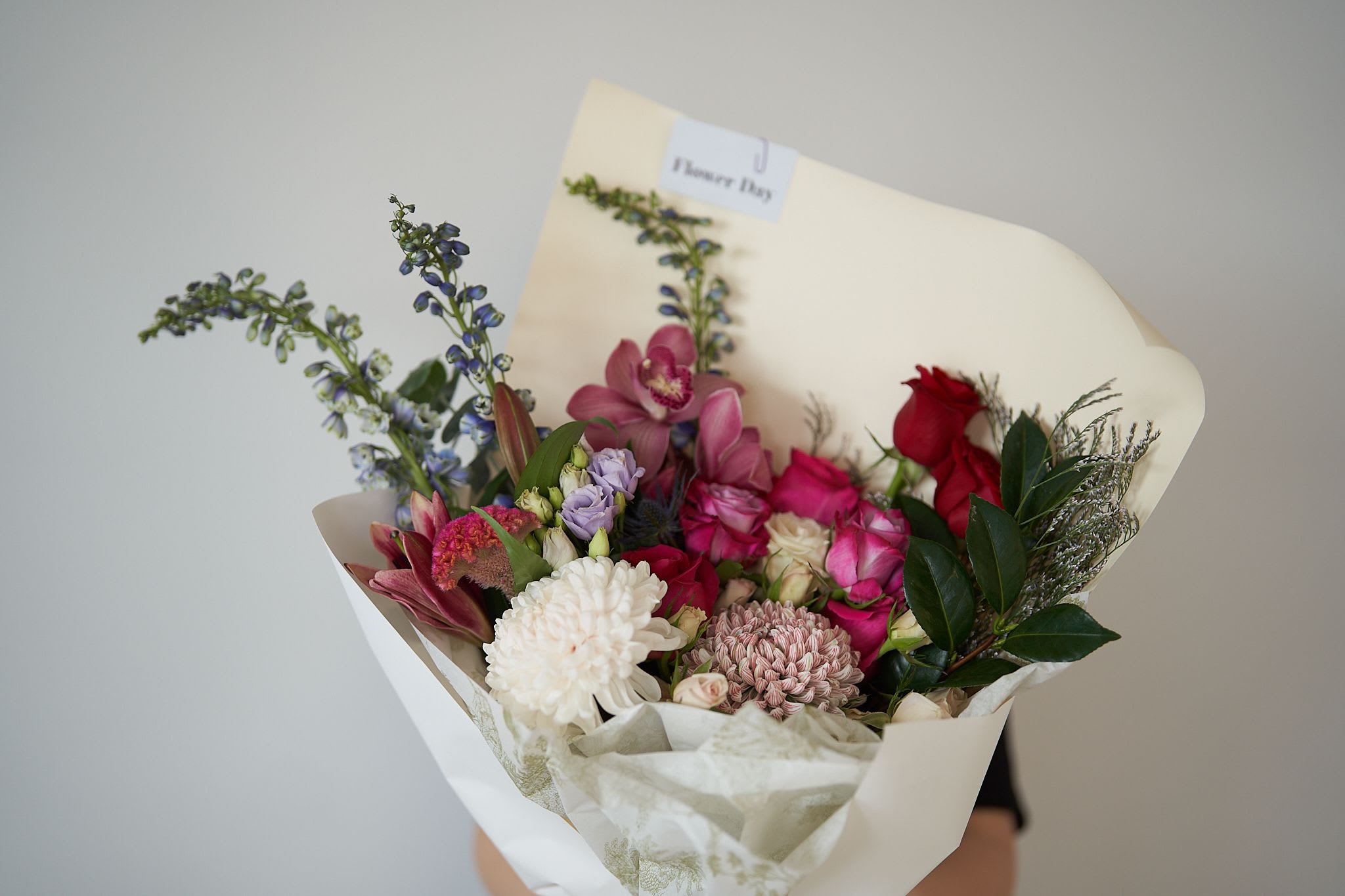 Red Rouge - *The selection of blooms varies seasonally* *The photo shows only a sample of the color palette and style. The final arrangement will be similar to the photo but will have unique and distinctive characteristics* 