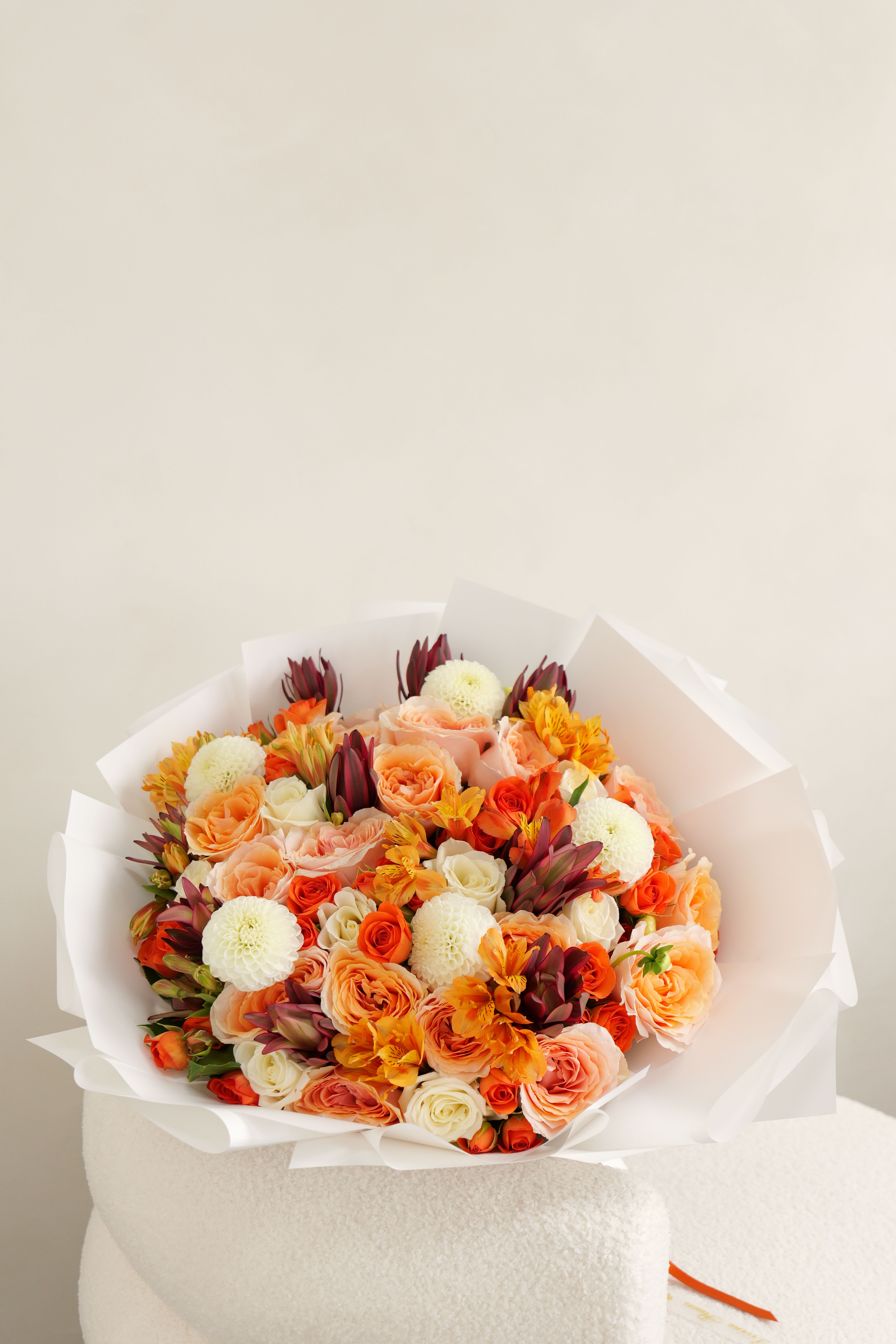 Sienna - Rich autumn colors and soft textures come together in a graceful bouquet perfect for the season.