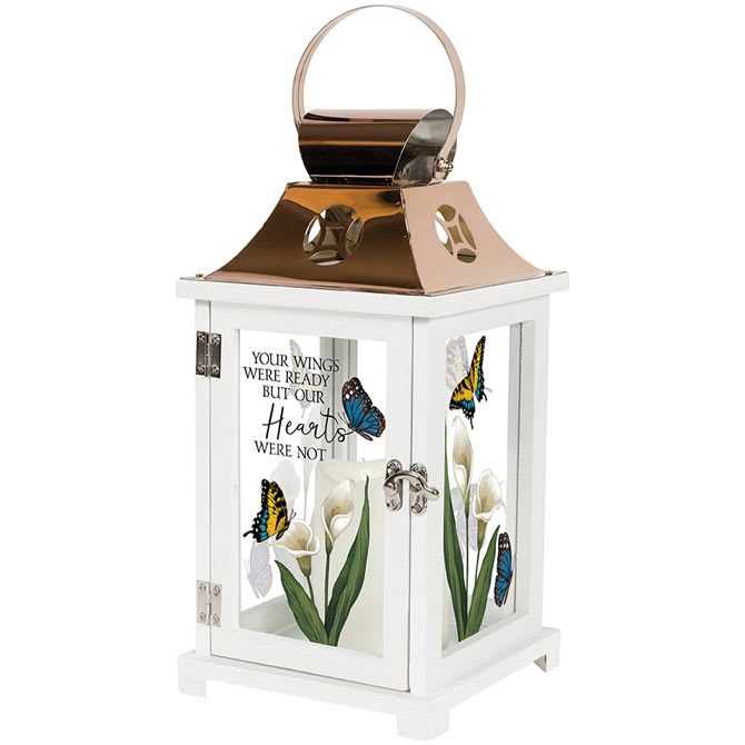 Sympathy Lantern 13.5&quot; - Your Wings - Your Wings Carson brand Flameless LED lantern is a beautiful way to honor and remember loved ones who have passed away. Crafted with quality wood and glass, this lantern features a stainless steel top with a copper finish and a metal handle, making it easy to display anywhere in the home.  The lantern comes with a built-in automatic timer, which operates on AAA batteries that we will provide. The timer is designed to provide a warm, welcoming glow for 6 hours, followed by 18 hours of rest, ensuring long-lasting use. This lantern is suitable for hanging or display free-standing, and is designed for indoor use only.  With a full-color picturesque motif of butterflies and peace lilies, this lantern is a stunning addition to any home. Plus, deluxe options with silk floral accents are available upon request or by selection when ordering online, allowing you to create an even more personalized gift.  This lantern is a thoughtful bereavement and condolence gift that can be sent directly to the residence or funeral home.  Dimensions: 13.5&quot; x 6.25&quot; x 6.25&quot;