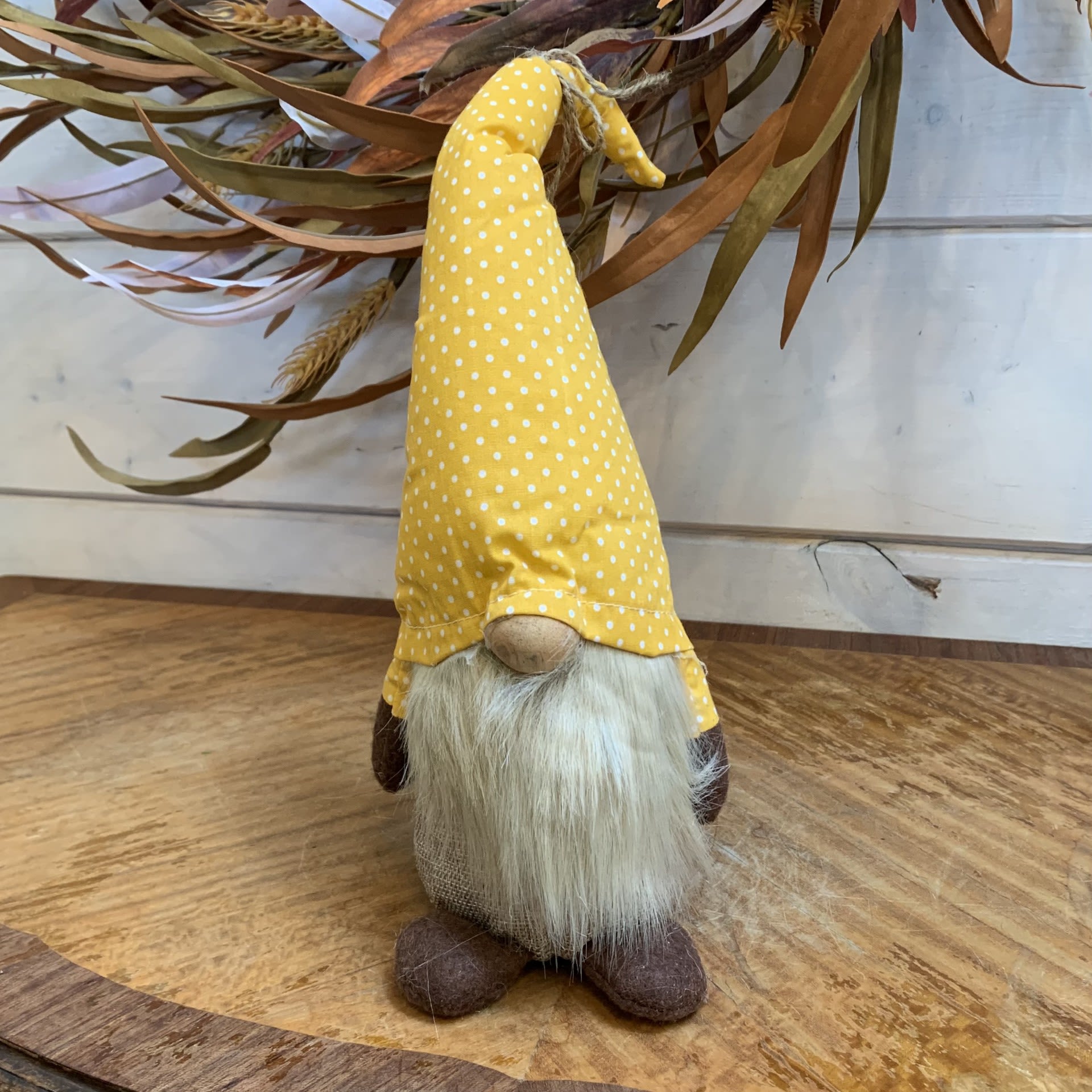 Orange Swiss Dot Crooked Hat Gnome - This medium size gnome has a charming adjustable hook to his hat that adds to his character. Approximately 12&quot; tall by 4&quot; wide, with a weighted base to keep him upright.  Not intended as a children's toy, for decorative use only. Made by MeraVic.  For additional gnome options, please check out our store at 3882 Mayberry Dr Ste A, Reno, NV 89519.