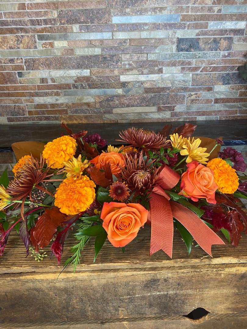 Traditions of Beauty - This is our classic, long and low centerpiece. Perfect for your holiday table. It will be created with the best blooms of the season to complete your table design. Enjoy these festive flowers while you enjoy your holiday meal. 