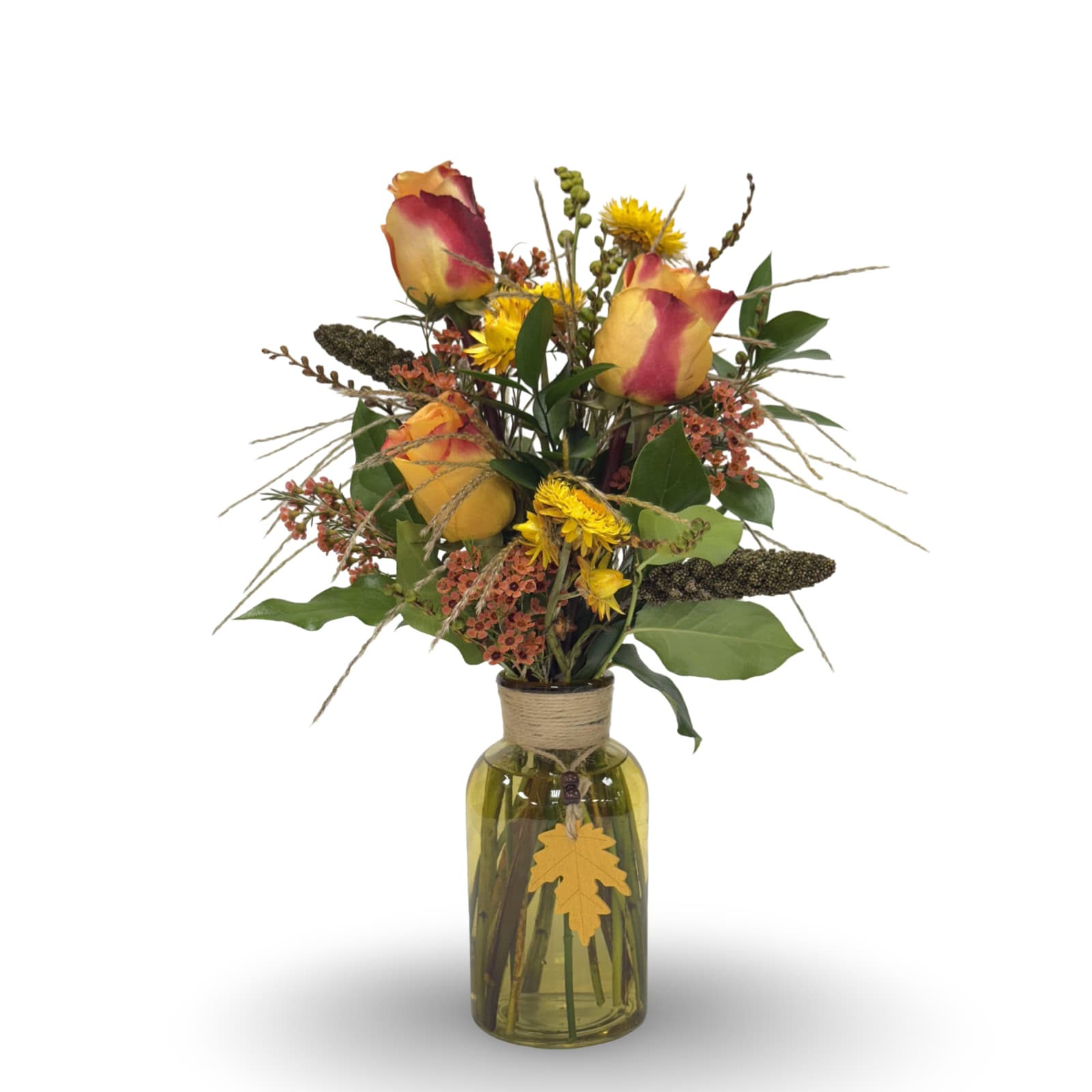 Cozy Fall - Embrace the warmth of autumn with Cozy Fall, a vibrant arrangement in a large yellow bud vase (approximately 20 × 11 inches) accented with a playful dangling fall leaf. Featuring roses, strawflowers, feather grass, wax flowers, and more, this bouquet showcases a rich yellow and orange autumn palette. Perfect for brightening your home or giving as a seasonal gift, it captures the cozy spirit of fall from every angle.