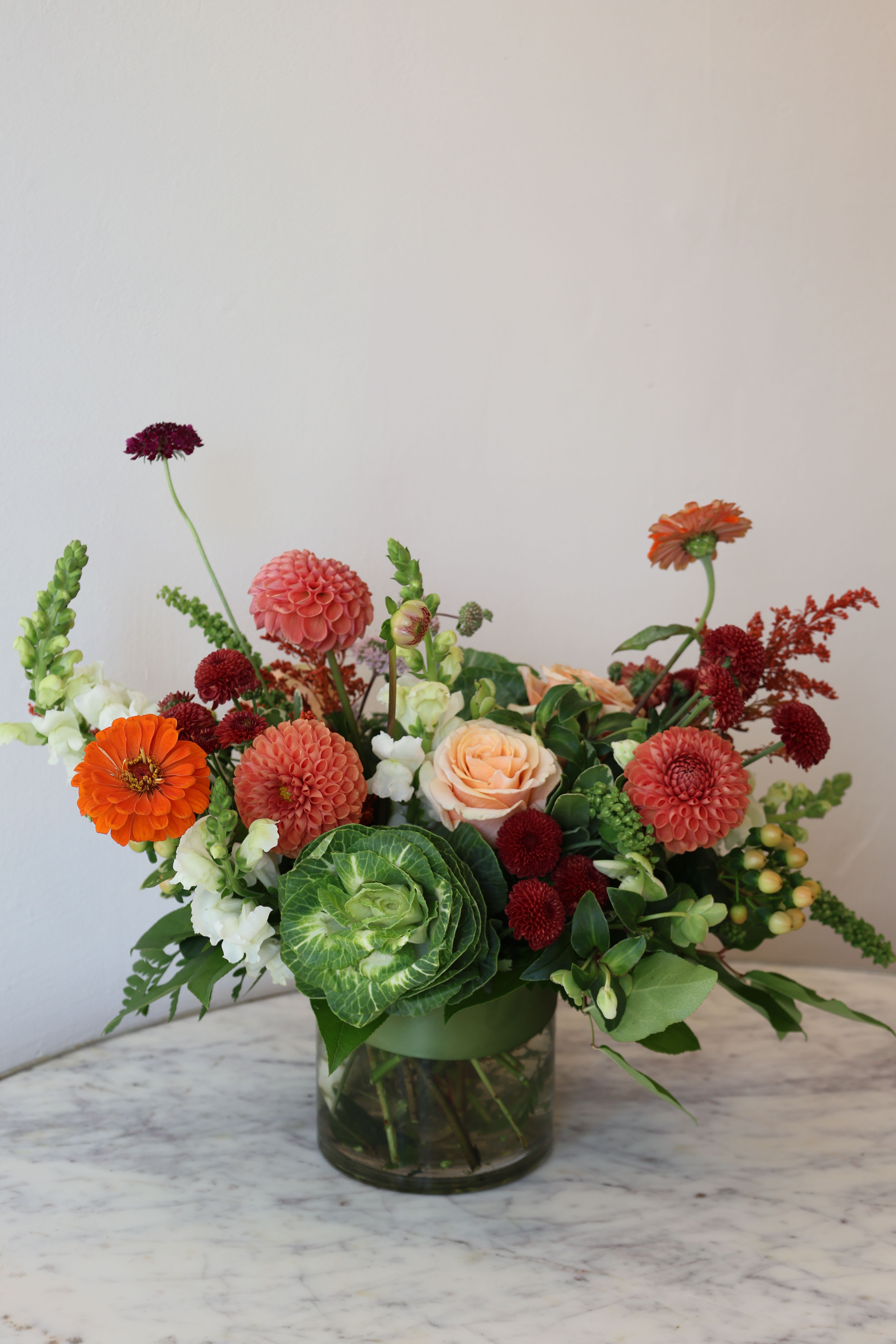 Crimson &amp; Coral - A fall inspired floral arrangement with seasonal blooms in a warm, light Autumnal color palette