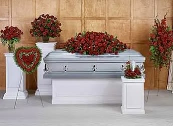 LOVELY PACKAGE - Elegant Red Rose Funeral Package  Honor your loved one with a beautifully coordinated Red Rose Funeral Package, designed to bring warmth, love, and remembrance to their final farewell.  This package includes:  Casket Spray – A lush arrangement of red roses, symbolizing deep love and respect.  Standing Heart Tribute – A heartfelt floral tribute in a heart-shaped design, expressing eternal love.  Large Pedestal Arrangements – Elegant floral displays framing the casket with grace and beauty.  Side Table Floral Pieces – Thoughtfully placed roses to enhance the service’s ambiance.  A dignified and timeless way to express your deepest condolences.   Available for delivery &amp; setup  Contact us for more details or to place an order. COLOR CAN BE CHANGE FOR SAME PRICE.