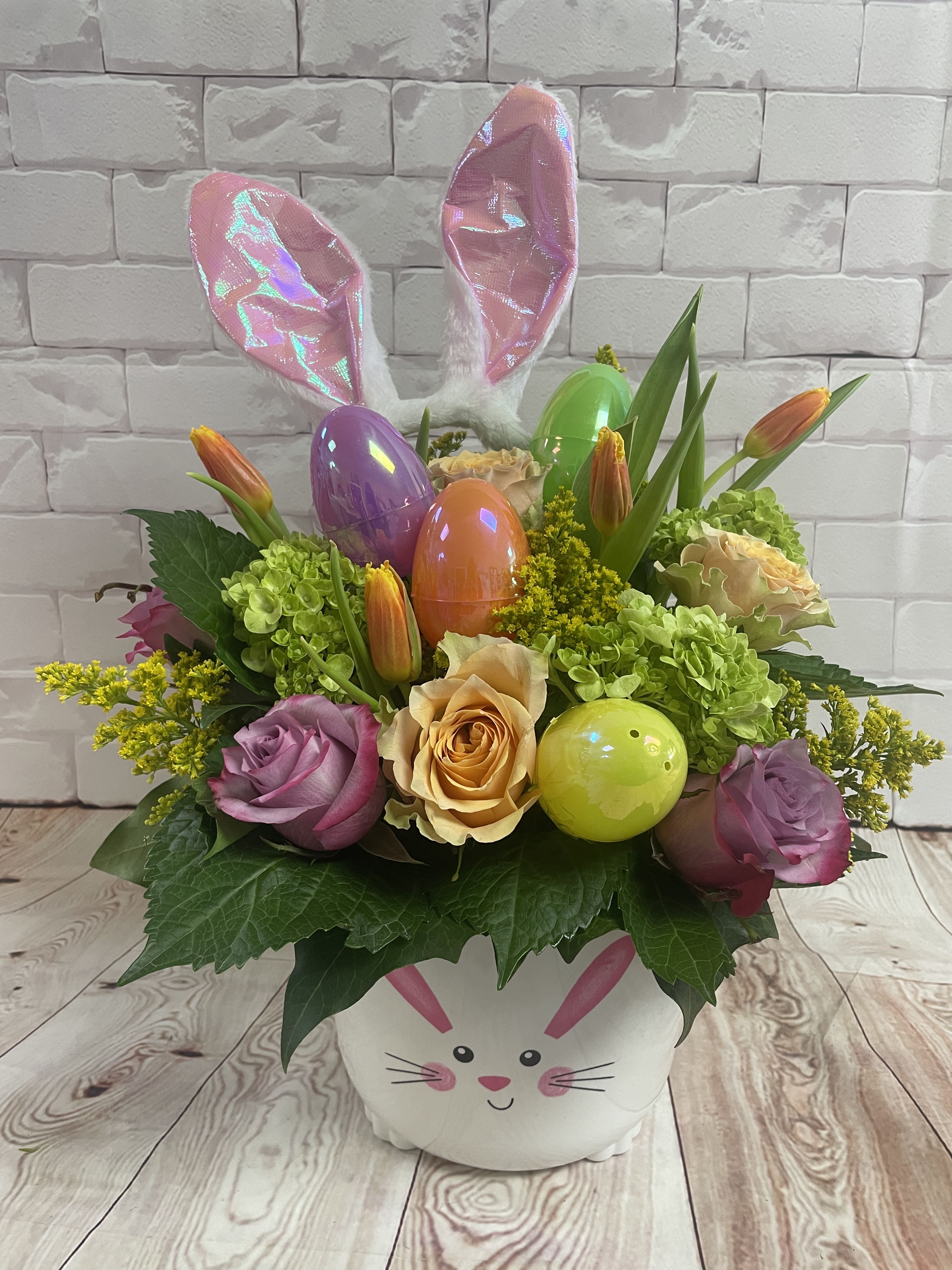 Blooming Bunny Flower basket  -  Spring flowers in a novelty Easter basket with wearable Bunny ears headband &amp; fillable Easter eggs !! Roses, hydrangea , tulips   ( 13wX19H) **container is seasonal, available thru April 1st-Apr 30 th ) **