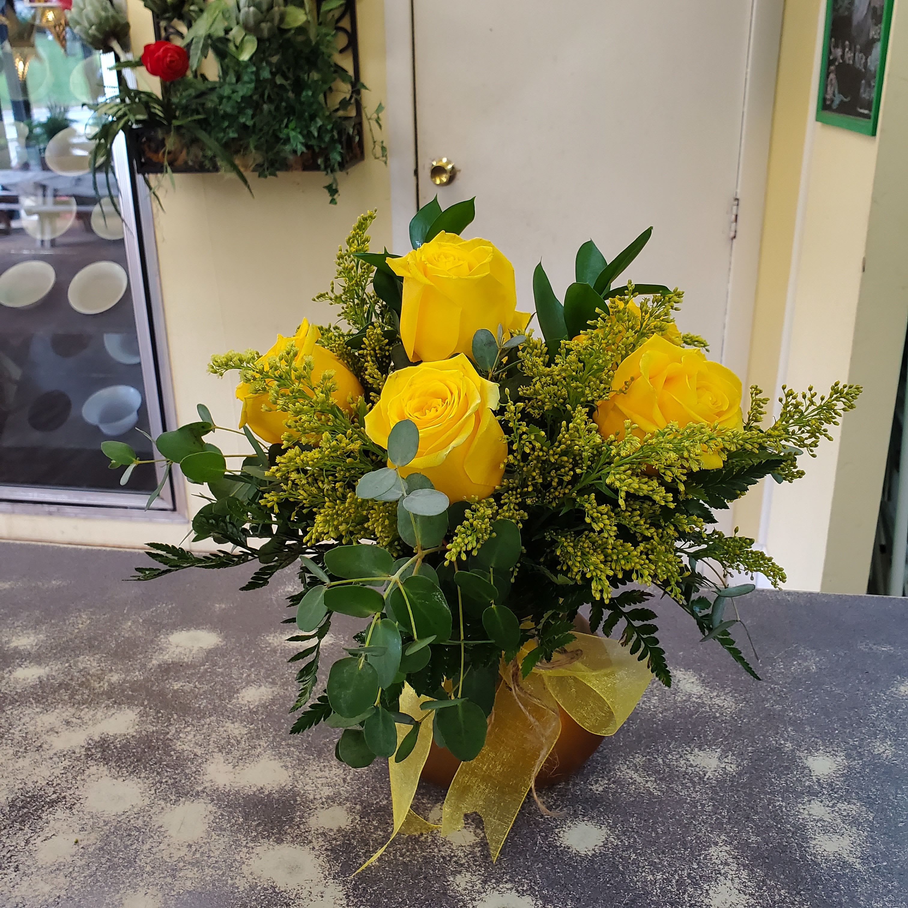 8 Rose Bunch Bouquet {Yellow} - A compact glass vase filled with 6 short assorted color roses,  a variety of greens and fill.  **COLORS WILL VARY DEPENDING ON THE AVAILABILITY OF THE DAY**