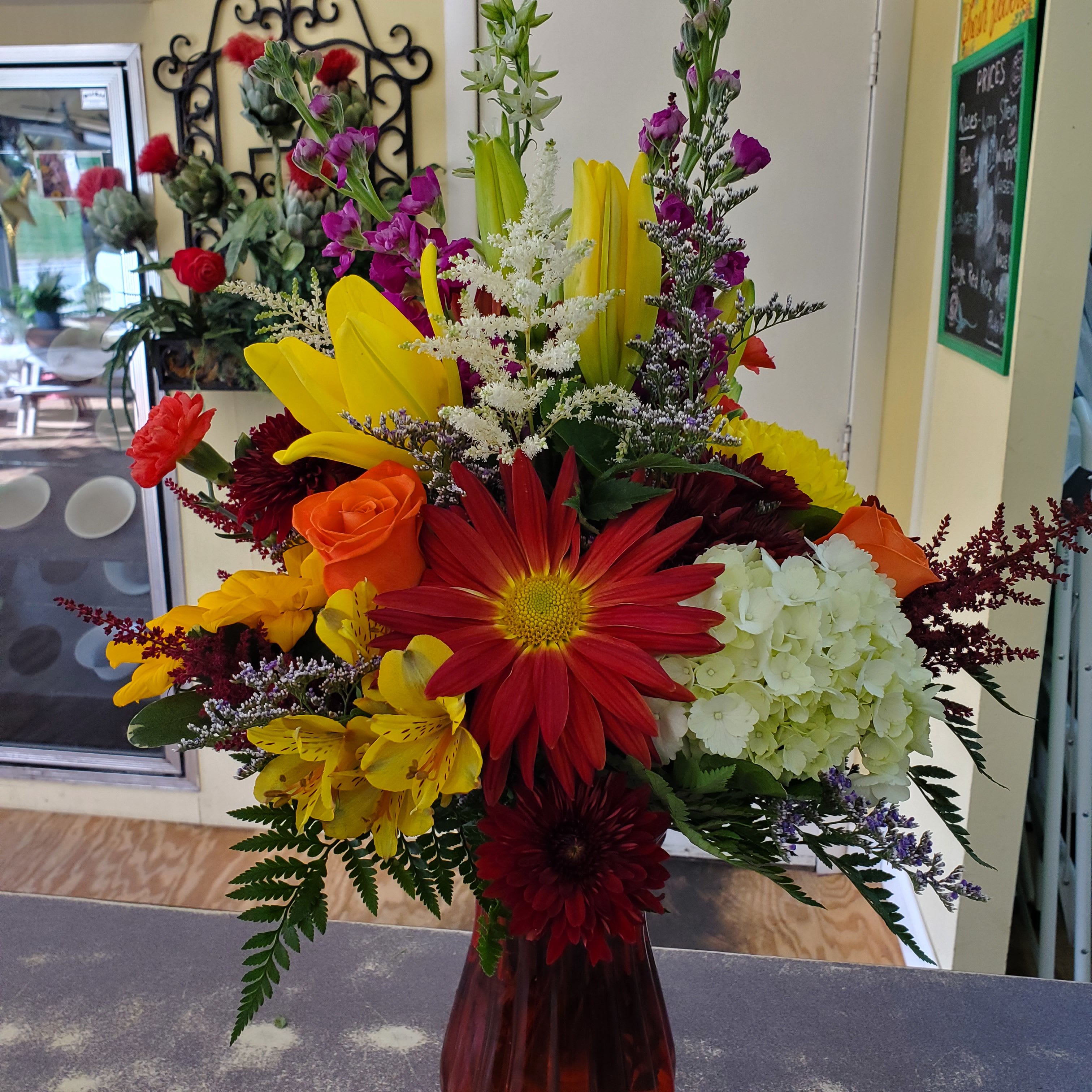 Autumn Day - Vase arrangement filled with assorted flowers and colors of the season. 