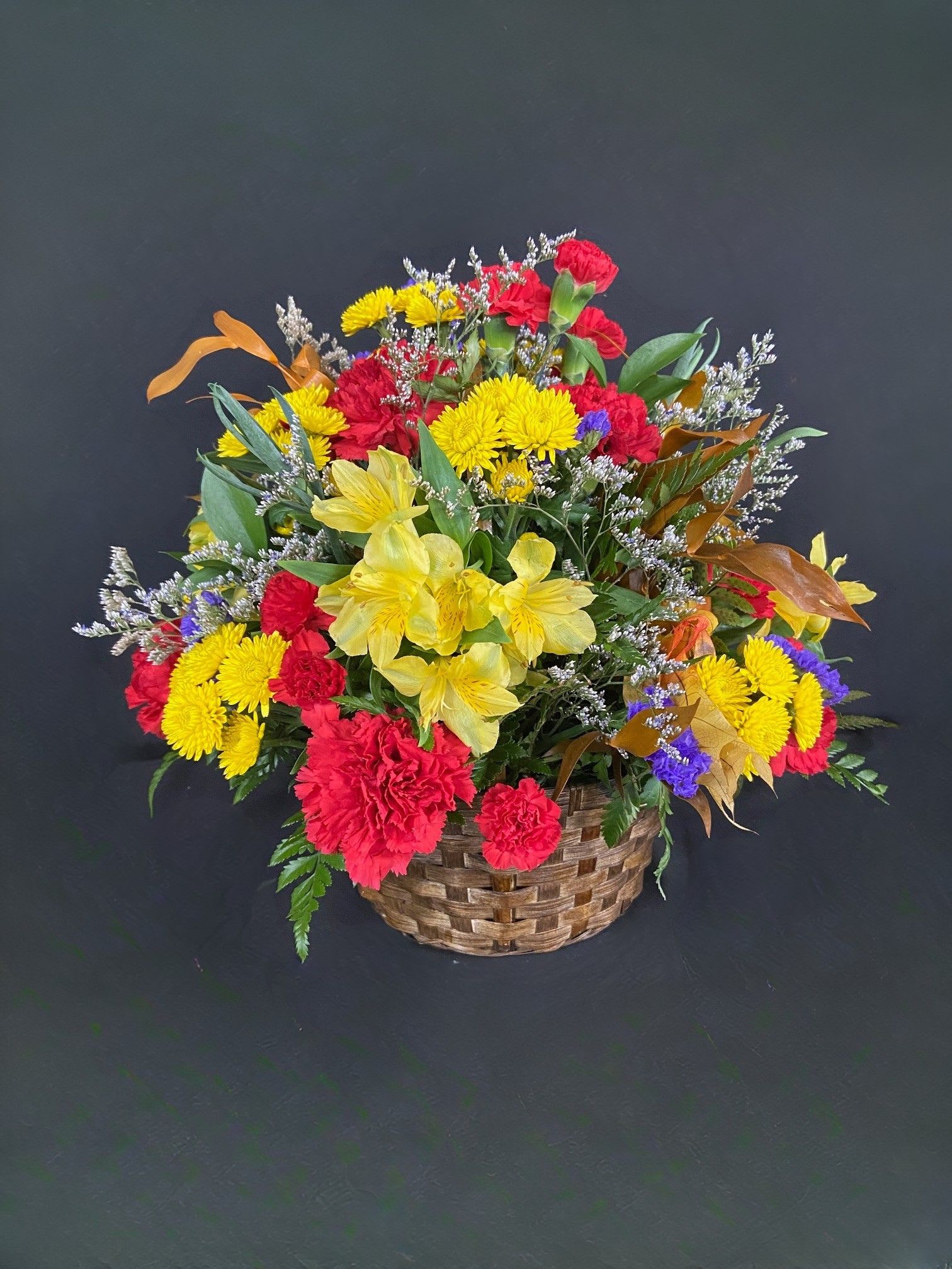 Basket of Fall Basket of Fall - An autumn twist on our ever popular Basket of Cheer - this Basket of Fall is bursting with fall colors and flowers accented with preserved fall leaves.