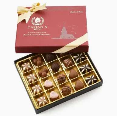 Carian's Bistro Chocolate - •  Made in Turkey •  Ingredients: Milk Chocolate (Milk Powder (Cow), Bitter chocolate, Sugar, Cocoa Butter, Cocoa Mass, Emulsifier (Sunflower Lecithin (E322)), Natural Vanilla Flavoring), Dark Chocolate, (Cocoa Mass, Sugar, Cocoa Butter, Emulsifier (Sunflower Lecithin (E322)), Natural Vanilla Flavoring), Hazelnut Cream Filling (Hazelnut Paste, Sugar, Vegetable Oil (Palm Kernel Oil), Milk Powder (Cow), Emulsifier (Sunflower Lecithin (E322)), Natural Vanilla Flavoring, Coffee Powder), Cream Filling (Sugar, Milk Powder (Cow), Vegetable Oil (Palm Kernel Oil), Flavoring (Coconut), Emulsifier (Sunflower Lecithin (E322)), Natural Vanilla Flavoring), Grated Coconut, Glazing Agents (Shellac (E904), Gum Arabic (E414)), Hazelnut, Coffee Bean, Amond •  Product Language: English •  Shelf life: 12–24 months •  Storage: Shelf-stable •  Weight: 1.12 lb (0.51 kg) •  Dimensions: 9.4 x 7.3 x 2.1 in (23.9 x 18.5 x 5.3 cm)   