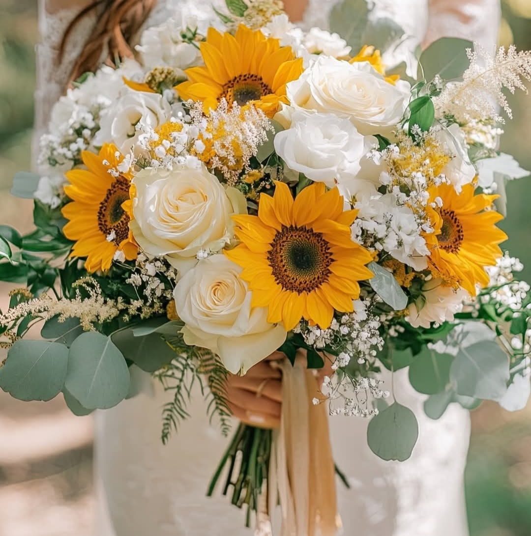 Bridal Bouquet Bridal Bouquet - This handtied bouquet features sunflowers and white roses. Perfect for anyones special day!