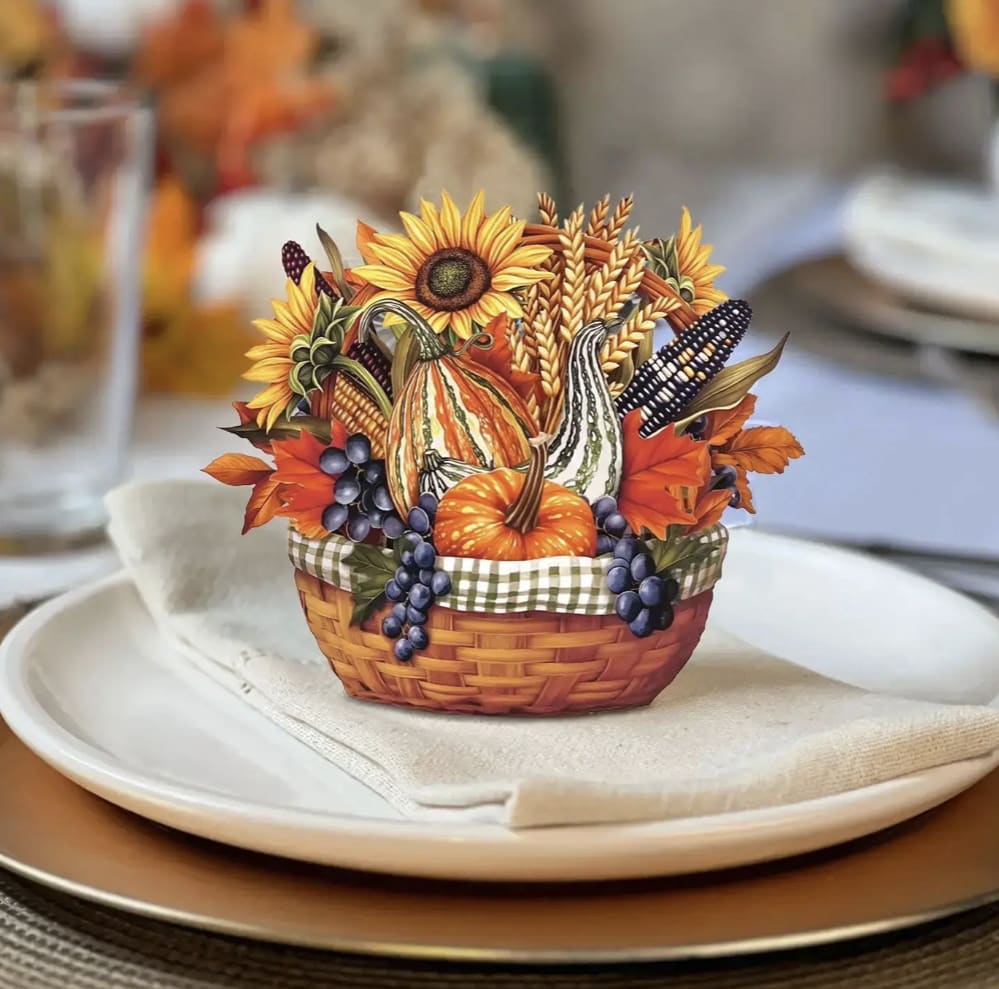 Mini Golden Harvest 3D Pop-Up Card - Small in size but full of seasonal warmth, the Mini Golden Harvest Pop-Up captures the essence of autumn’s golden hour. This petite paper flower bouquet features a charming basket filled with sunflowers, gourds, corn, and fall leaves — perfect for Thanksgiving place settings, thoughtful hostess gifts, or cozy home accents. Rustic, radiant, and easy to display, this mini pop-up greeting card adds a cheerful harvest touch that lasts long after the leaves fall.  WHAT'S INCLUDED: * VIBRANT MAILING ENVELOPE * MINI POP-UP BOUQUET WITH PAPER BASKET * BLANK NOTECARD  Measures 5” high by 5” across Printed on both sides