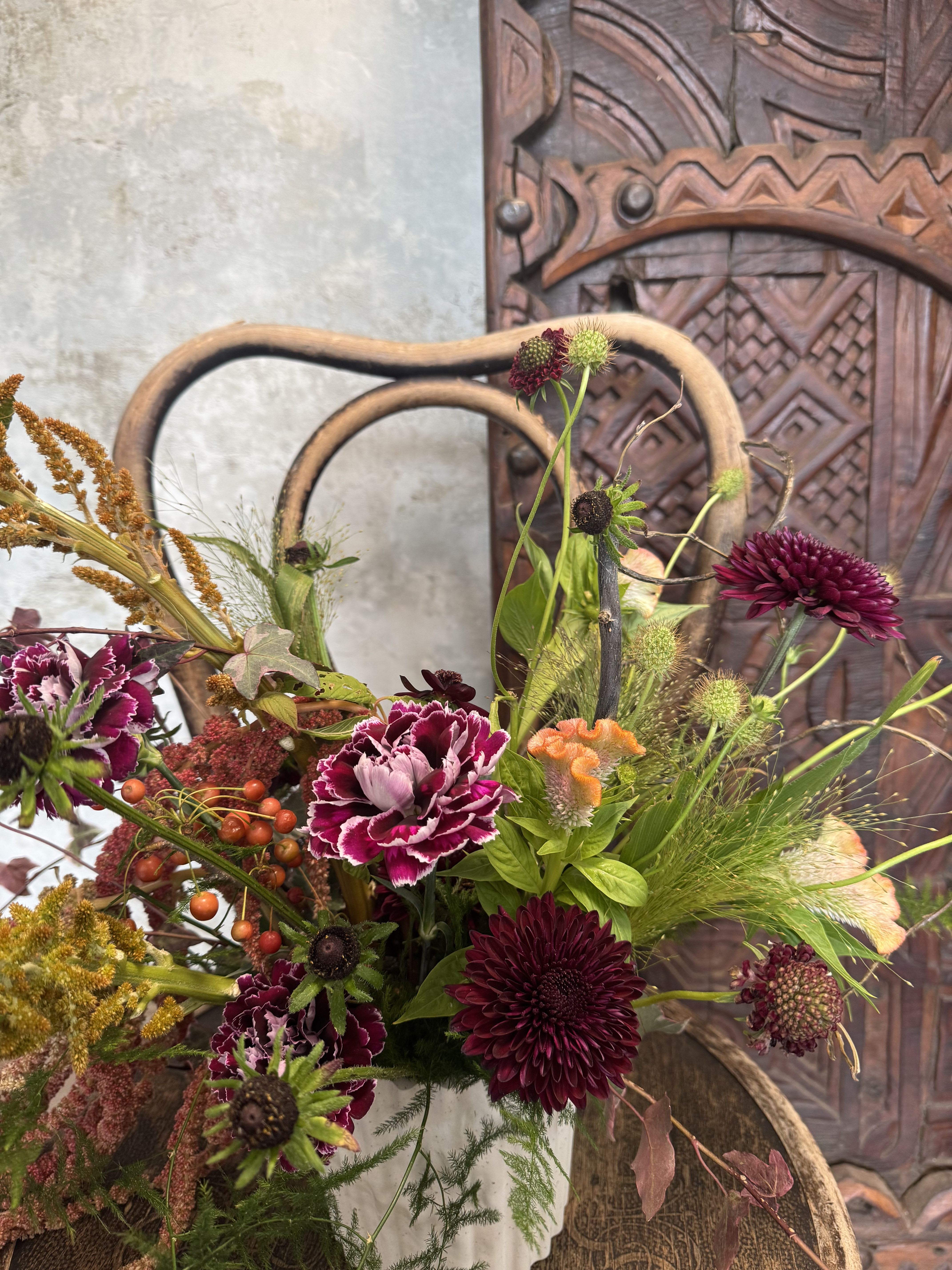 Autumn Whispers Vase Arrangement - Let the quiet magic of fall fill your home with this one-of-a-kind seasonal arrangement. Designed in a beautiful vase, each piece is thoughtfully crafted to capture the warmth and charm of autumn. Expect a painterly mix of seasonal blooms with rich tones, soft textures, and unexpected details that feel both wild and inviting. Every arrangement is unique, a little celebration of the fleeting beauty that this season brings.  Available in three sizes, with larger options offering even more abundant layers of blooms and foliage to brighten your table, entryway, or gift to a loved one. Whether it’s to mark a special occasion or simply to savor the coziness of fall, this arrangement is designed to bring a touch of seasonal enchantment wherever it’s placed.