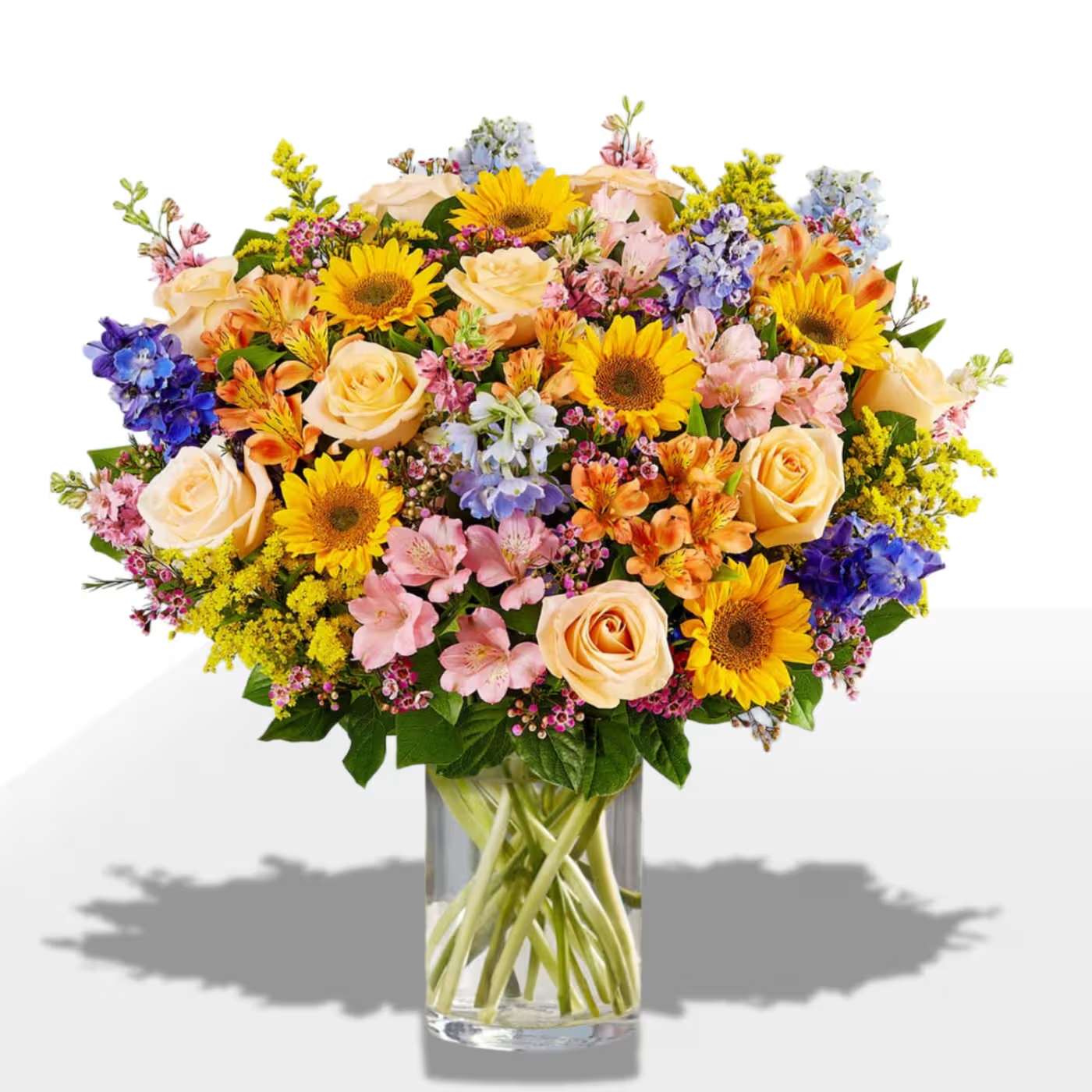 Spring Sensation by Manny - Mixed colorful arrangement in a cylinder vase 