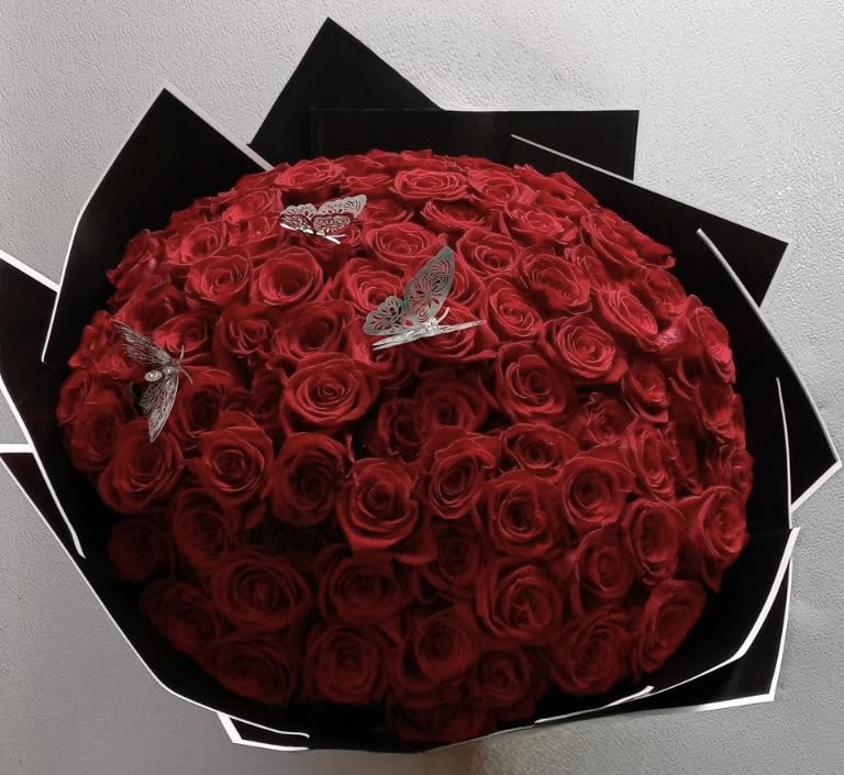 All Rose Bouquet (100 ct.) - 100 roses arranged into a round bouquet with the color paper of your choosing and color of rose of your choosing. Accessories included.