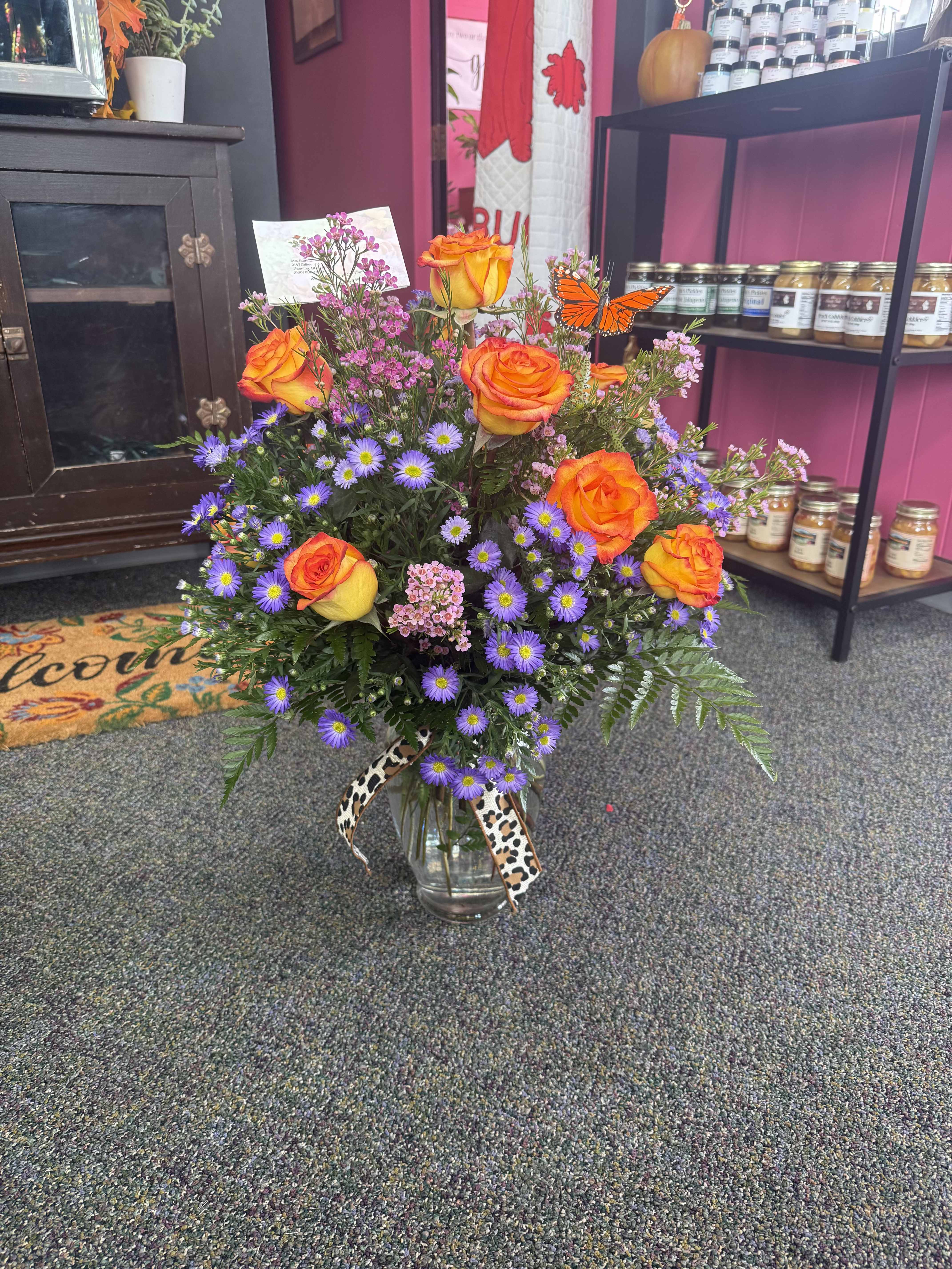 Dozen Roses - 12 Roses in a vase with Filler Please call for a certain color rose.  **Some Rose Color's may be out of stock**