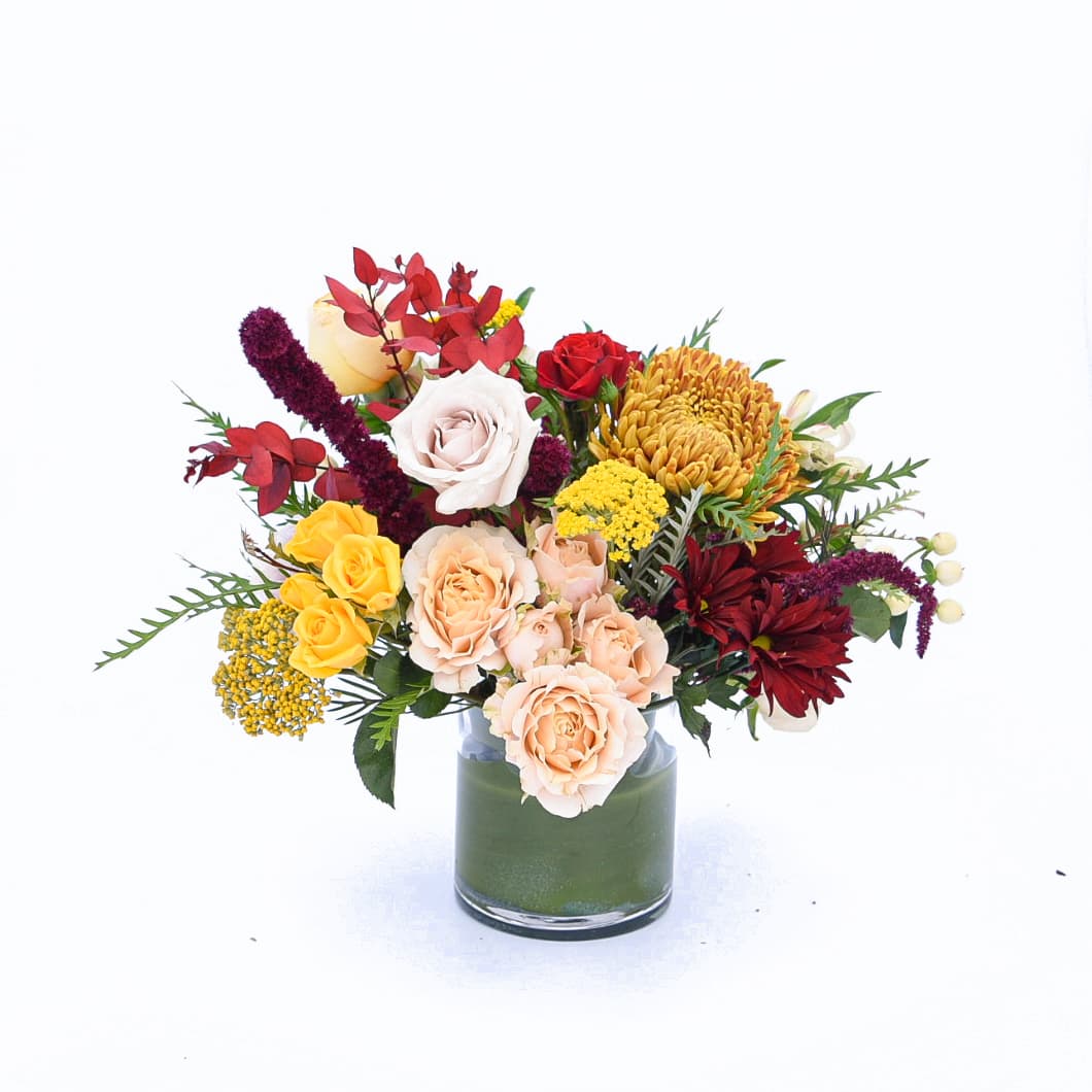 Sugar Maple Cobbler - Sweet as pie-- a beautiful blend of autumnal textures and tones that will have your mouth watering.  PLEASE NOTE:  Standard price-point is a low and lush arrangement presented in a short glass cylinder. Approximately 14&quot;W x 12&quot;H  Deluxe price-point is a high and tall arrangement in a tall cylinder. Approximately 20&quot;W x 24&quot;H.