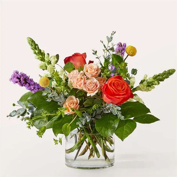 The Standout Bouquet - Leave a lasting impression with The Standout Bouquet, a vibrant and bold mix of orange and purple florals.  Details The Premium Bouquet is approximately 13&quot;H x 15&quot;W. Designed by florists, ready to display. For long–lasting blooms, replace the water daily. We suggest trimming the stems every couple days. Pet Safety Precautions: This bouquet or plant may include flowers and foliage that are known to be toxic to pets. To keep them safe, be sure to keep this arrangement out of your pet's reach.  Bloom Details Veronica Snapdragon Eucalyptus Rose