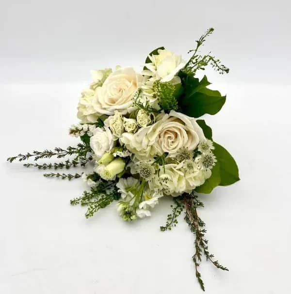 White Nosegay - Modern look with a variety of fresh white florals. When ordering please specify your choice of satin ribbon color under special instructions or it will be wrapped in a neutral color. Designers may need to implement substitutions, however will follow the general arrangement style and color theme. Standard price point is pictured.