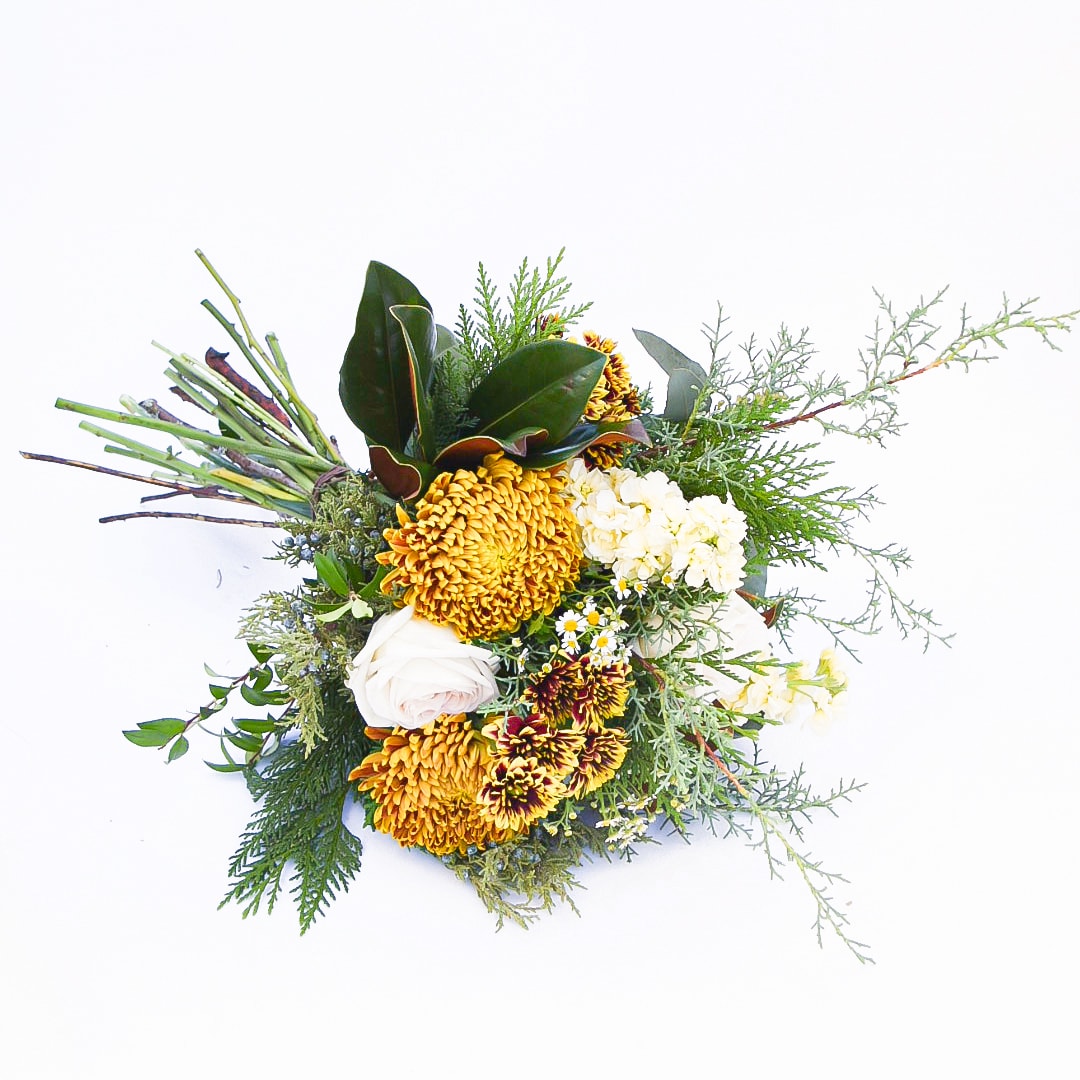 Woodland Incense - Nature lovers know the peace that comes with a walk in the woods. This style brings mixed greenery and foliage to the forefront, with bronze and buff tones to accent the natural greenery featured.  PLEASE NOTE: Standard price-point is a hand-tied bouquet with no vase. Approximately 14&quot; across the top of the flowers  Deluxe price-point is a low and lush arrangement presented in a short glass cylinder. Approximately 16&quot;W x 12&quot;H  Premium price-point is a high and tall arrangement in a tall cylinder. Approximately 20&quot;W x 26&quot;H.