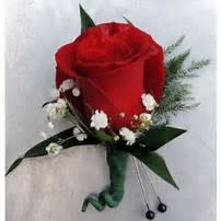 Boutonniere with Red Rose - The classic finishing touch  to any man's special outfit. Designed with seasonal filler and greens. We carry a wide array of ribbon to accent/compliment his date's outfit as well!    