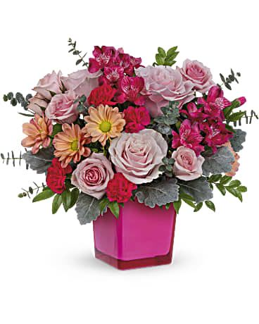 Growing Love Bouquet  - Growing Love Bouquet is X's and O's bundled up into a rosy arrangement! This sweet array of blooms is arranged in the Rose Color Splash cube. Pink roses, pink spray roses, hot pink alstroemerias, miniature hot pink carnations, and beige daisy spray chrysanthemums are arranged with dusty miller, huckleberry, and spiral eucalyptus. Delivered in the Rose Color Splash Cube. **KEEPSAKE VASE / SMALL ARRANGMENT **